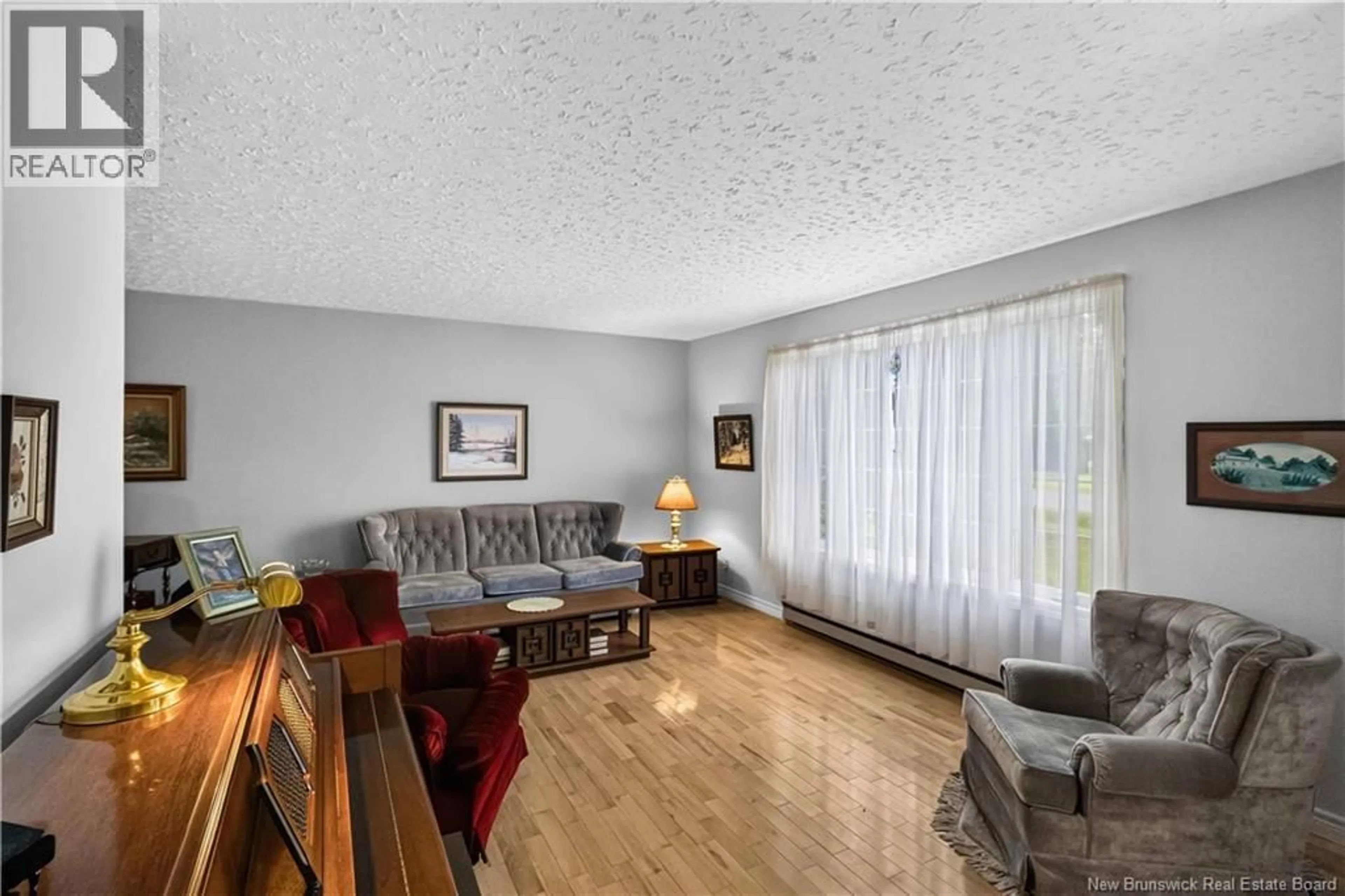 Living room with furniture, wood/laminate floor for 192 SPRINGWATER LANE, New Maryland New Brunswick E3C1J1
