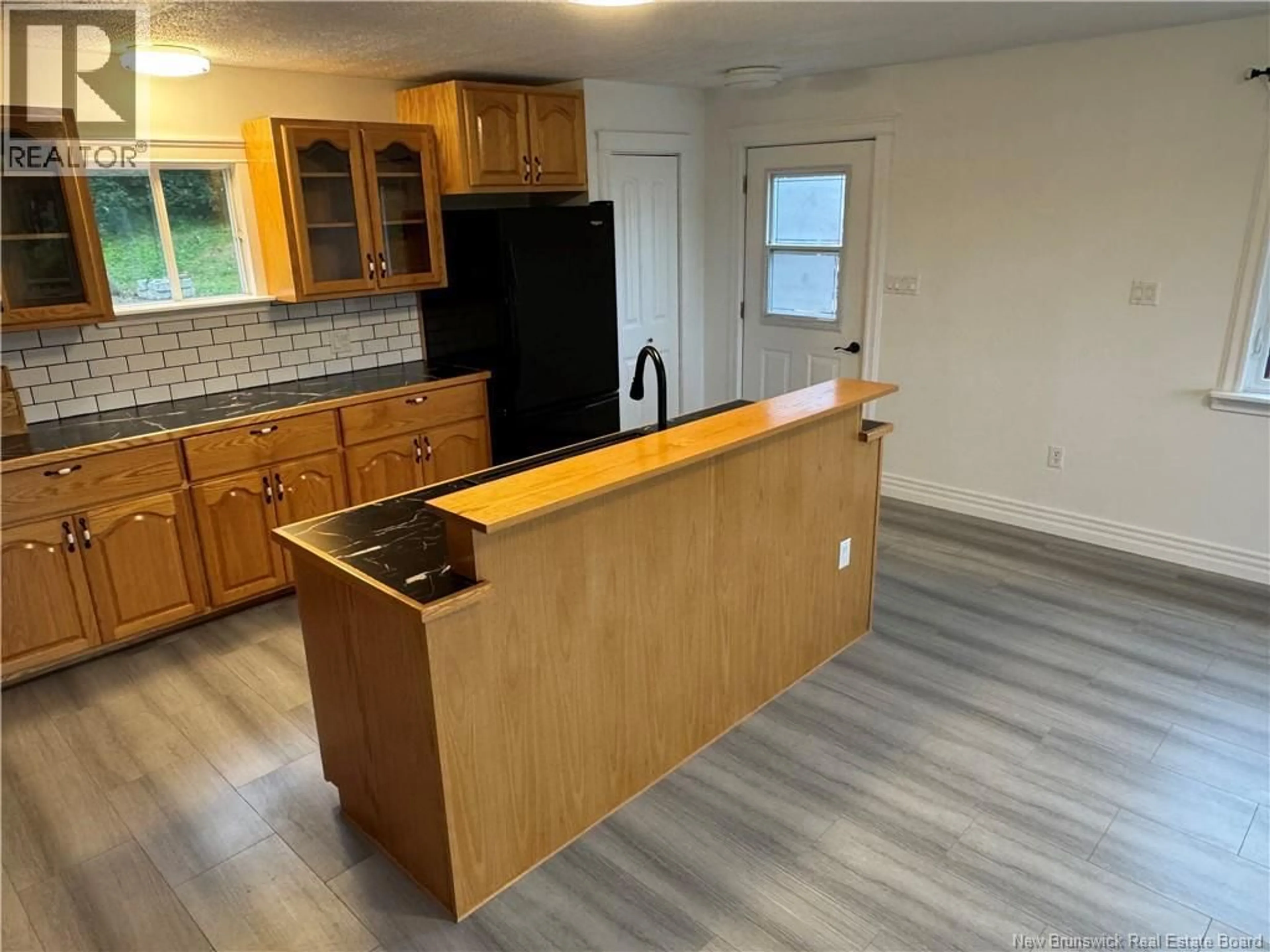 Open concept kitchen, wood/laminate floor for 61 HOSPITAL STREET, Bath New Brunswick E7J1B7