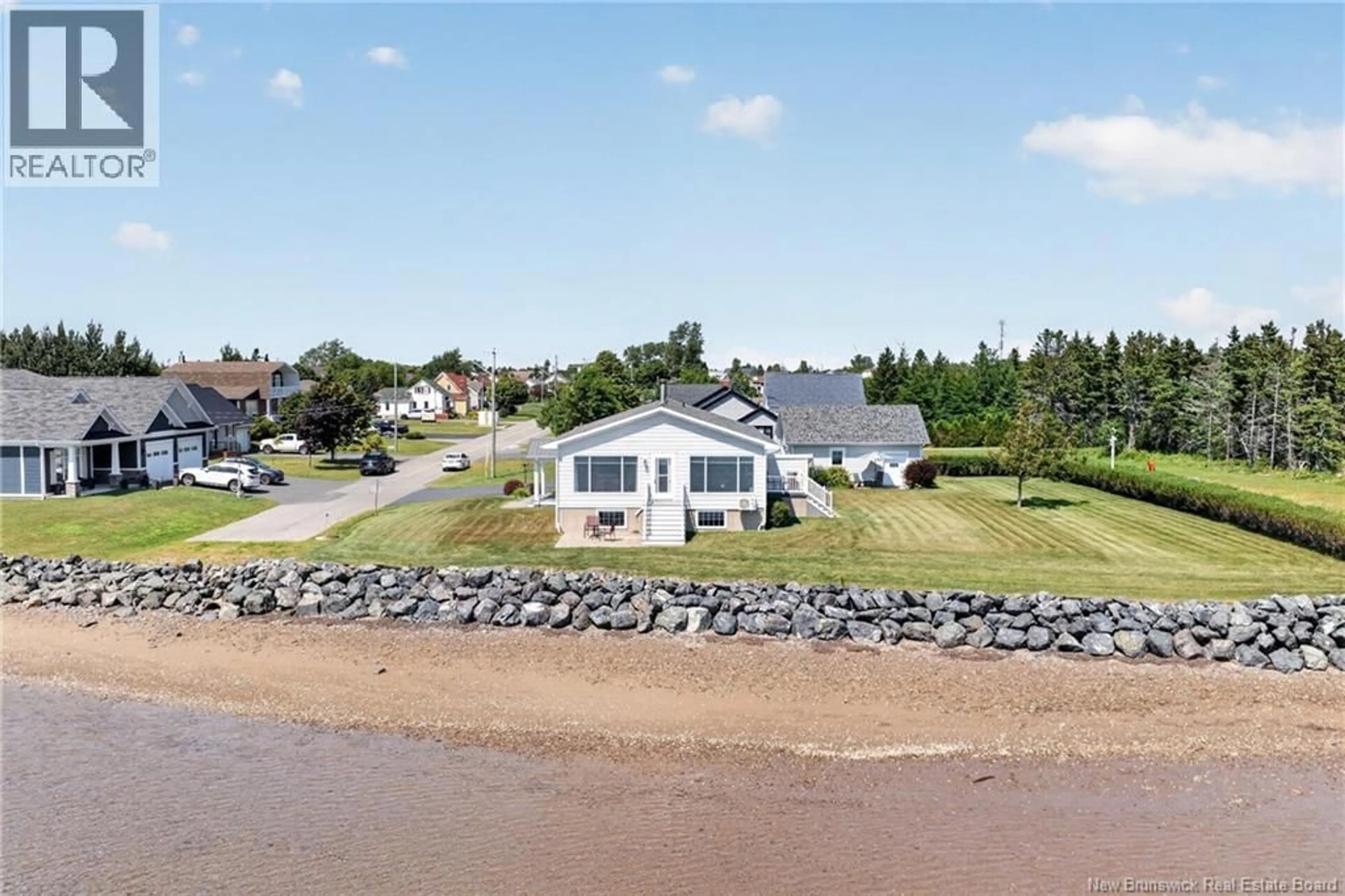 A pic from outside/outdoor area/front of a property/back of a property/a pic from drone, water/lake/river/ocean view for 11 RUE DU PÊCHEUR, Lamèque New Brunswick E8T1L3