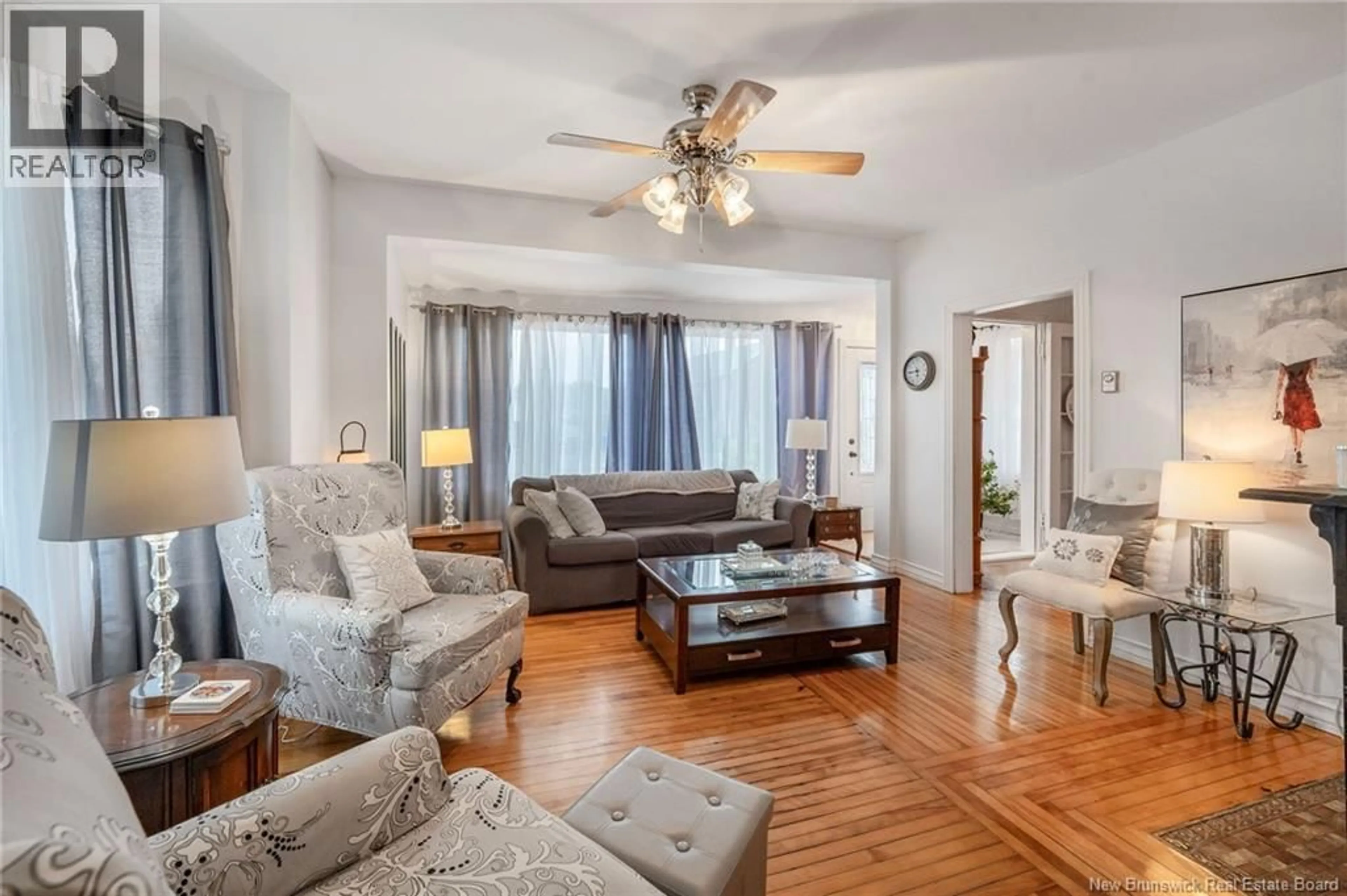 Living room with furniture, wood/laminate floor for 119 SAUNDERS ROAD, McAdam New Brunswick E6J1L7