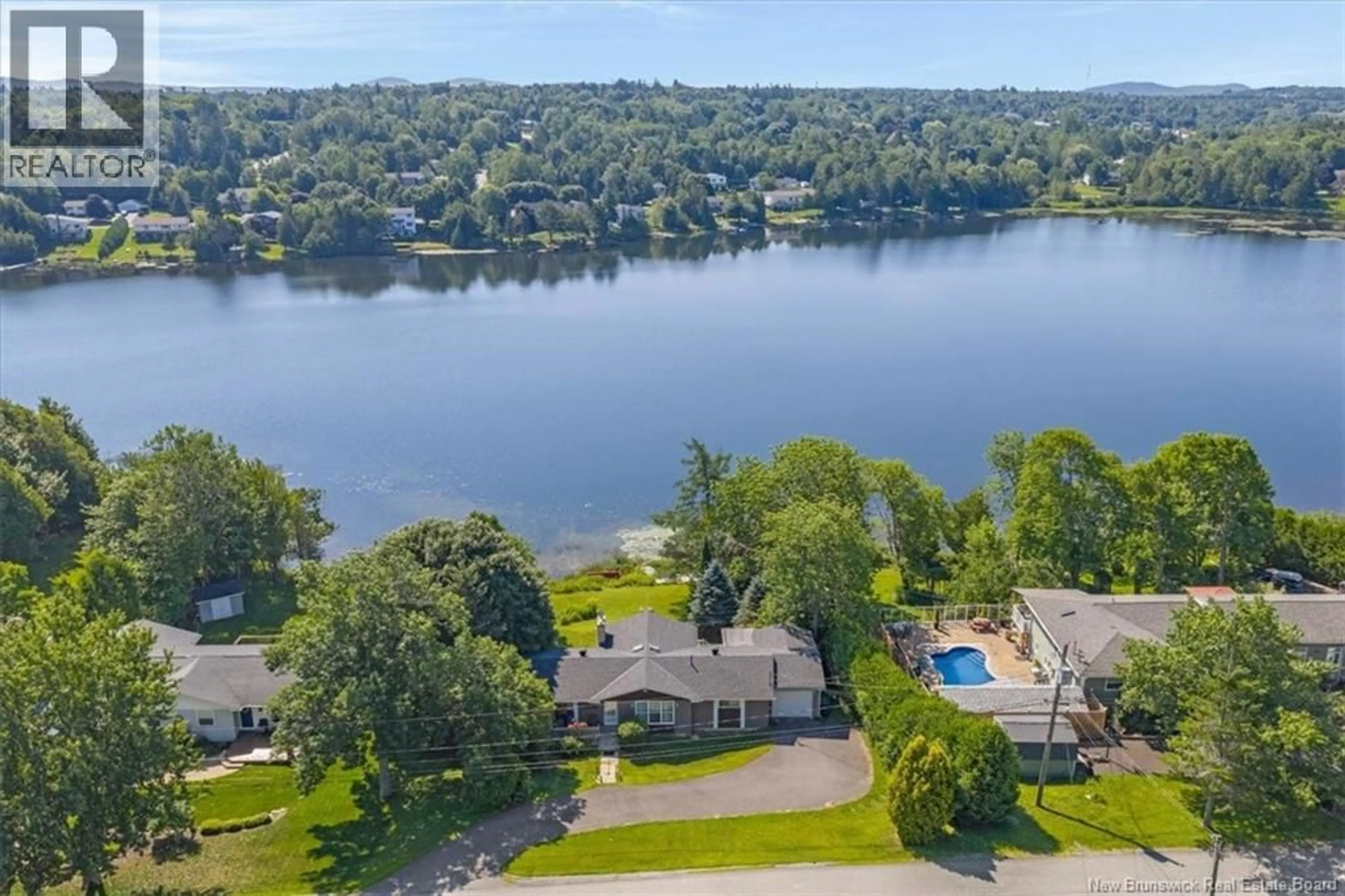 A pic from outside/outdoor area/front of a property/back of a property/a pic from drone, water/lake/river/ocean view for 32 MAPLE GROVE COURT, Quispamsis New Brunswick E2E3S1