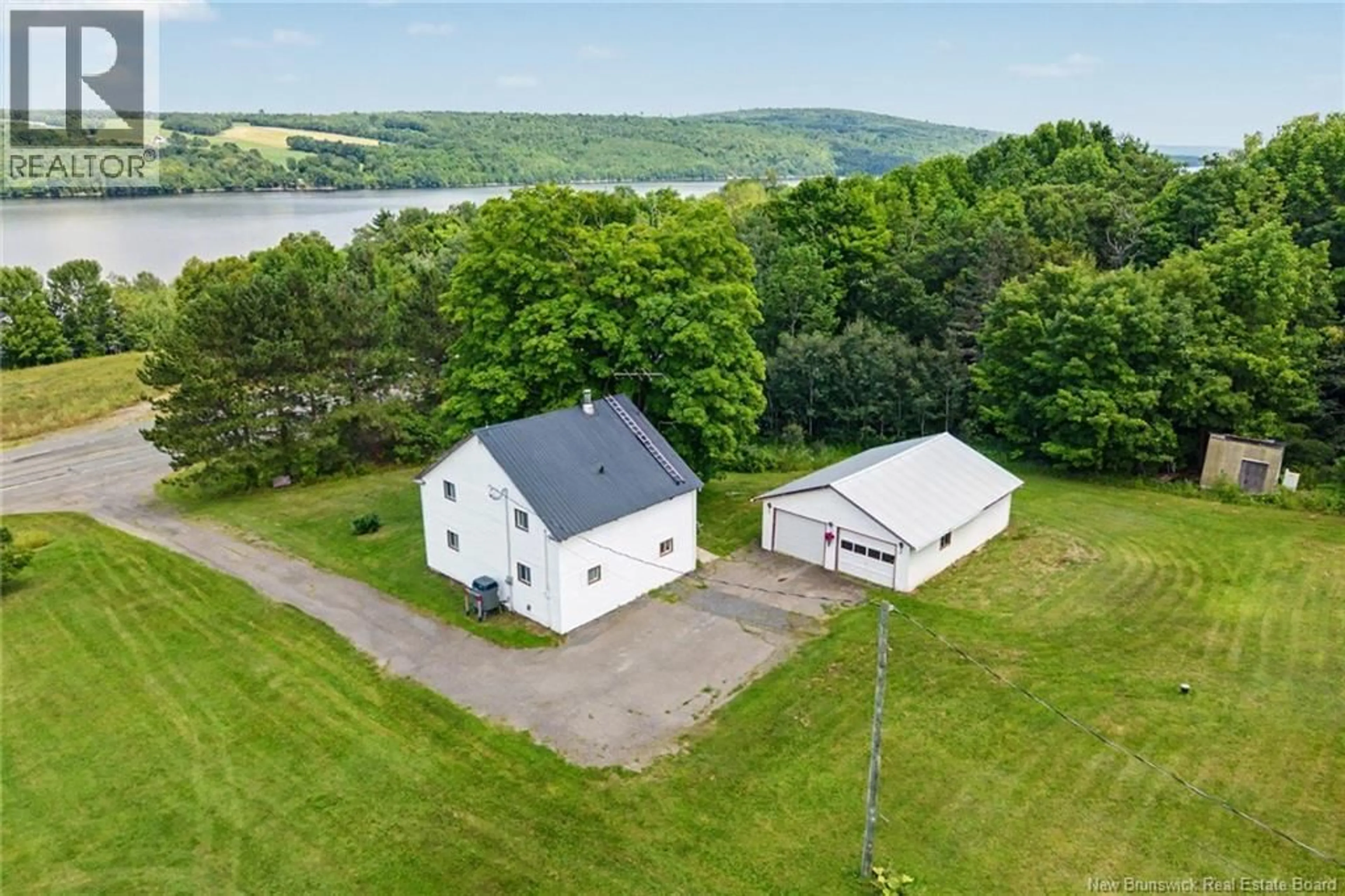 A pic from outside/outdoor area/front of a property/back of a property/a pic from drone, water/lake/river/ocean view for 7304 RTE 102, Dumfries New Brunswick E6G1P8