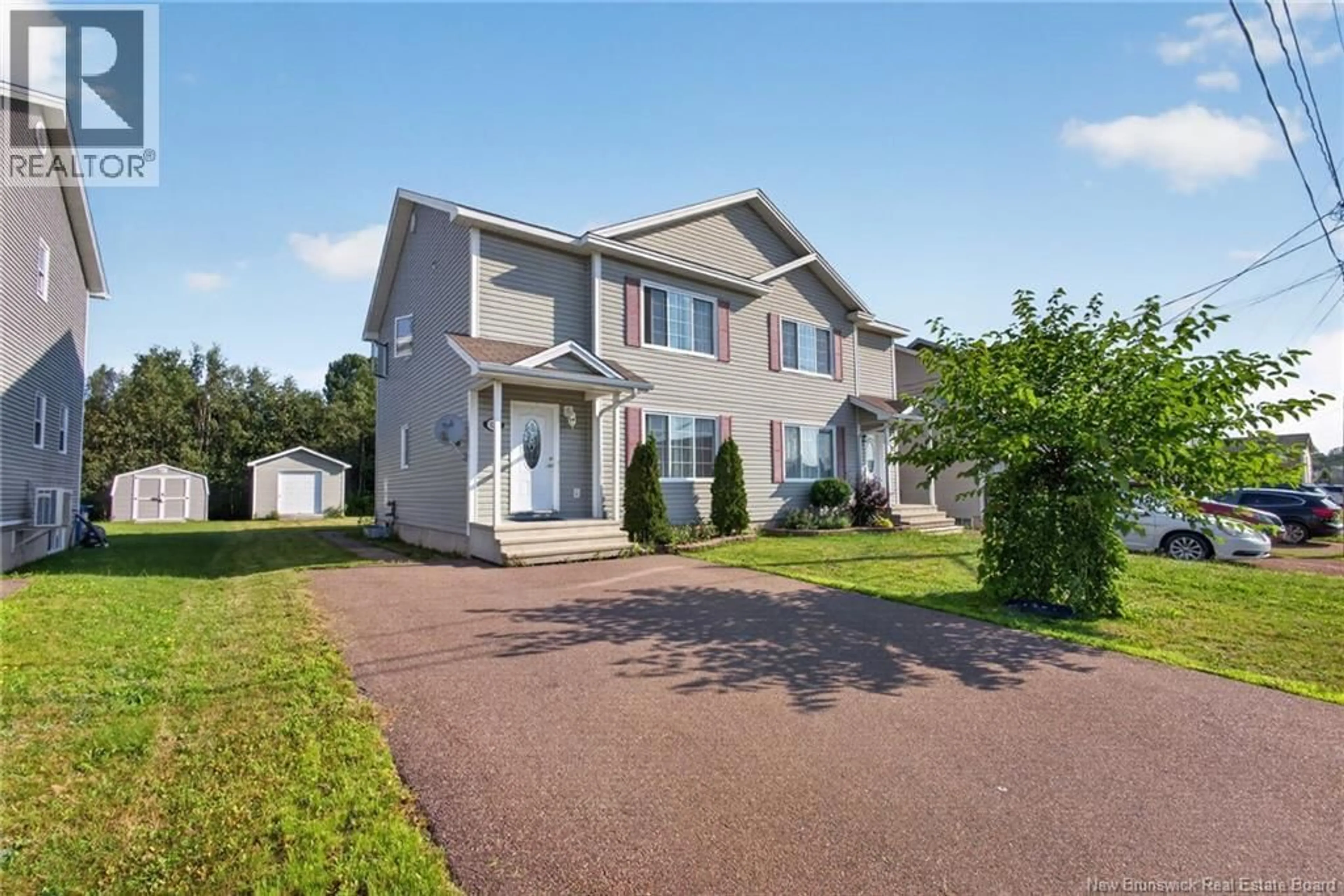 Home with vinyl exterior material, street for 137 HOULAHAN STREET, Dieppe New Brunswick E1A4X6