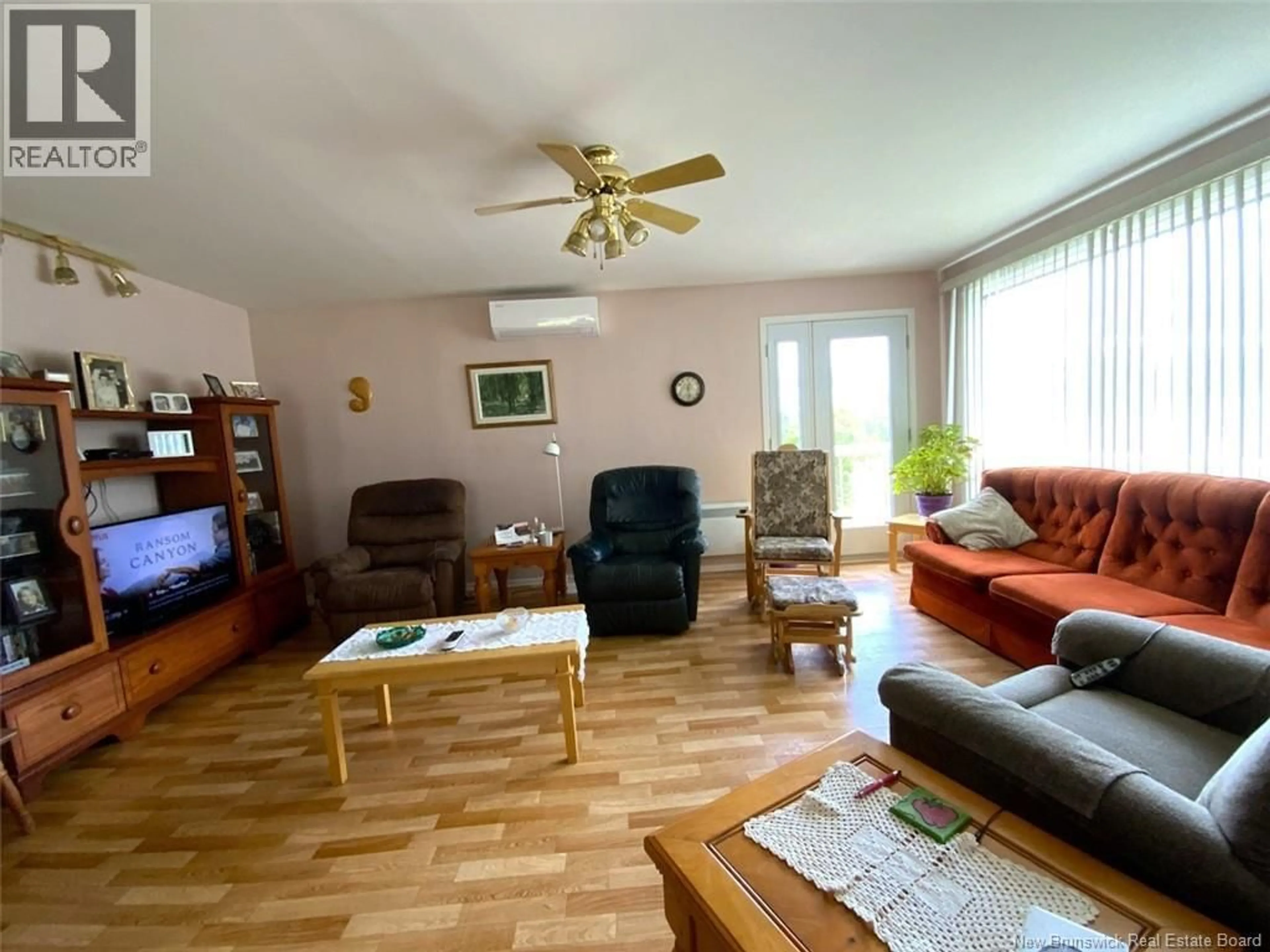 Living room with furniture, wood/laminate floor for 1463 ST-FRANÇOIS STREET, Edmundston New Brunswick E3V3P9