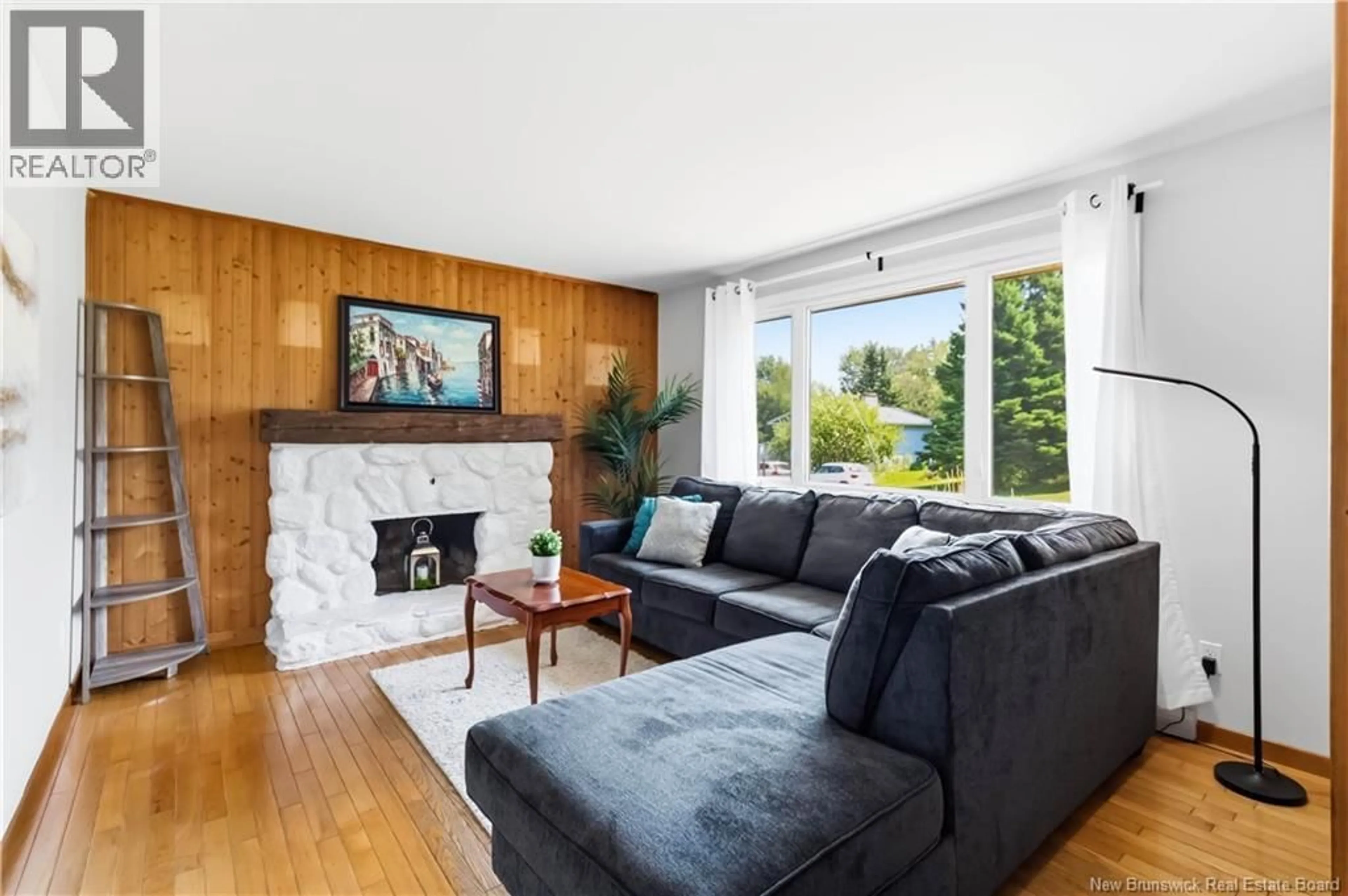 Living room with furniture, wood/laminate floor for 73 LAURELLE AVENUE, Moncton New Brunswick E1G1G2