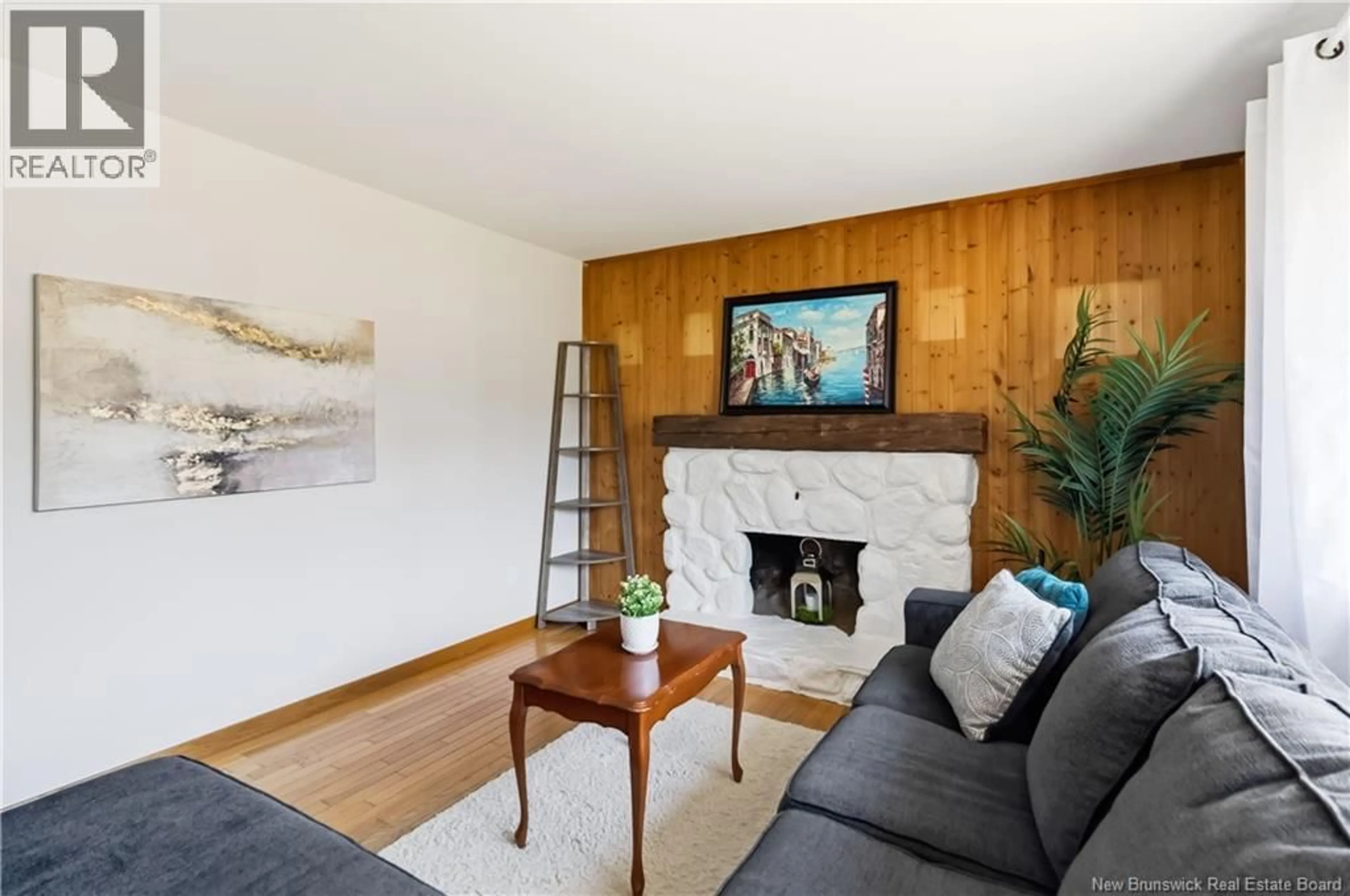 Living room with furniture, wood/laminate floor for 73 LAURELLE AVENUE, Moncton New Brunswick E1G1G2