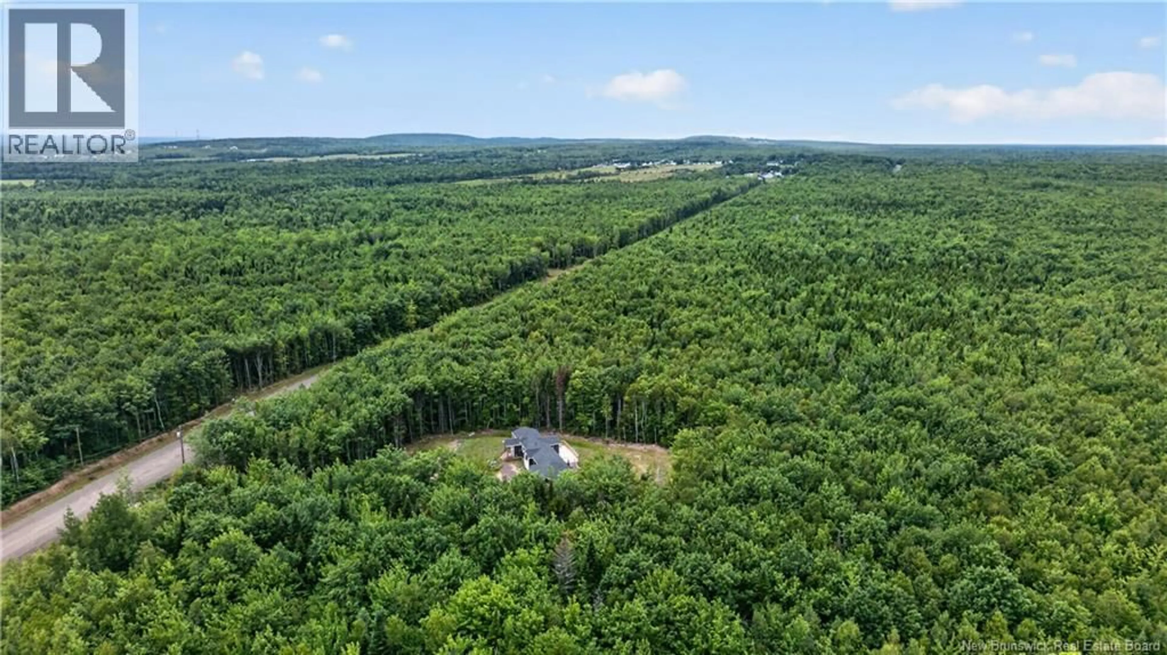A pic from outside/outdoor area/front of a property/back of a property/a pic from drone, forest/trees view for 25-26 ROY SCENIC DRIVE, Irishtown New Brunswick E1H2N5