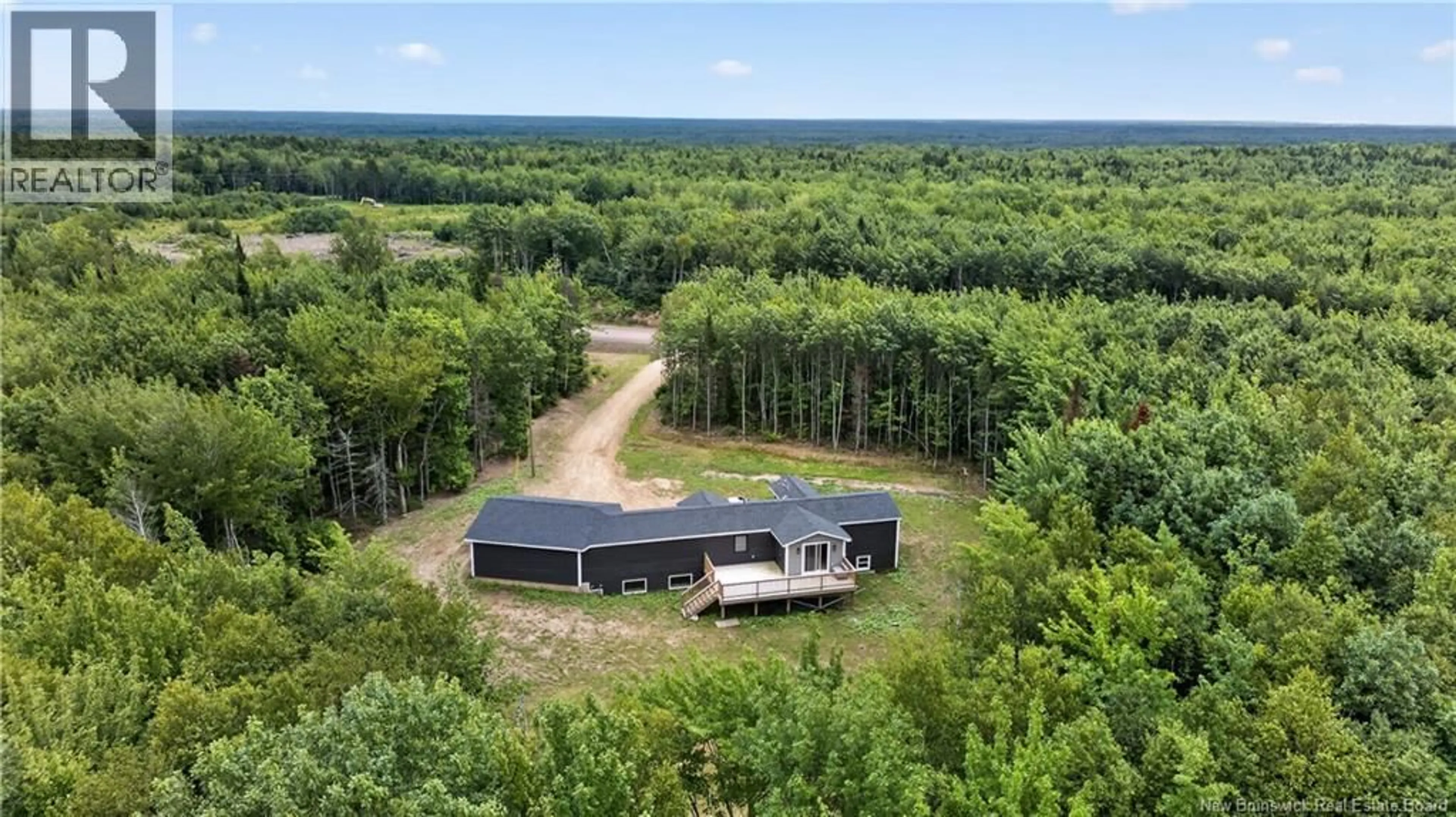 A pic from outside/outdoor area/front of a property/back of a property/a pic from drone, forest/trees view for 25-26 ROY SCENIC DRIVE, Irishtown New Brunswick E1H2N5