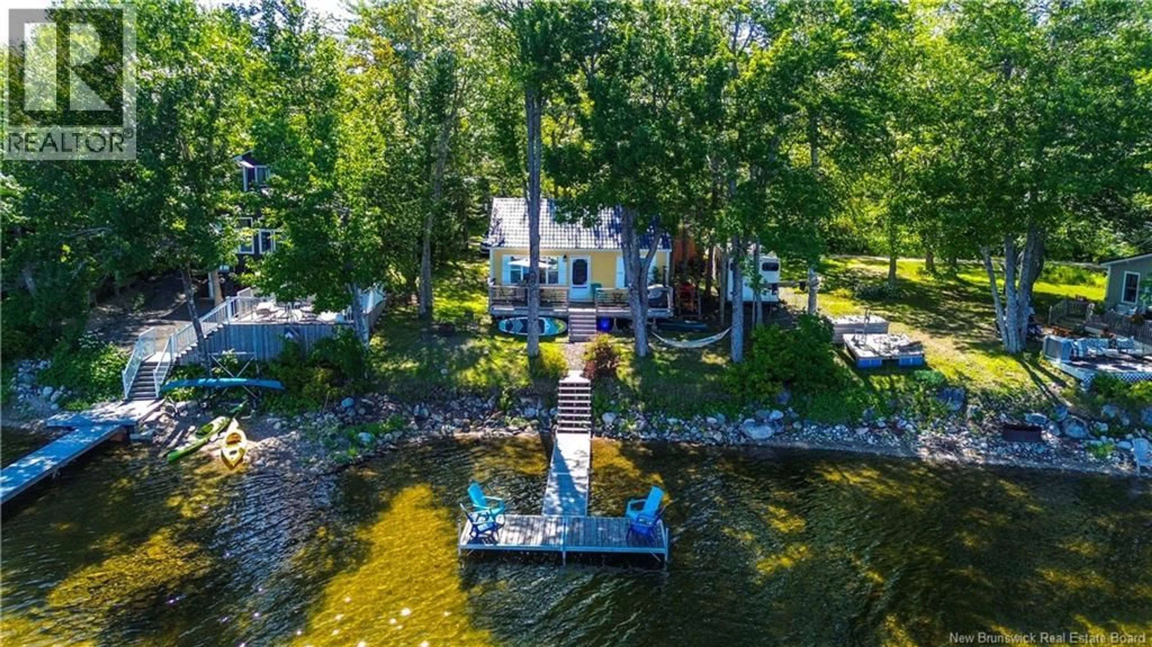 A pic from outside/outdoor area/front of a property/back of a property/a pic from drone, water/lake/river/ocean view for 82 COTTAGE LANE, Lake George New Brunswick E6K3H5