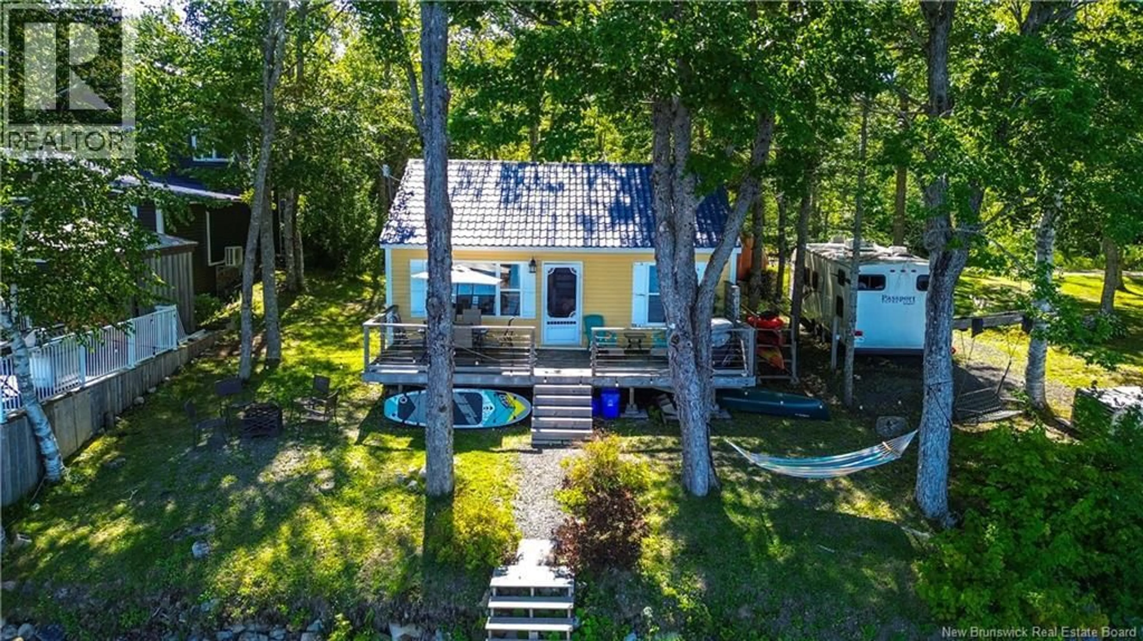 A pic from outside/outdoor area/front of a property/back of a property/a pic from drone, water/lake/river/ocean view for 82 COTTAGE LANE, Lake George New Brunswick E6K3H5