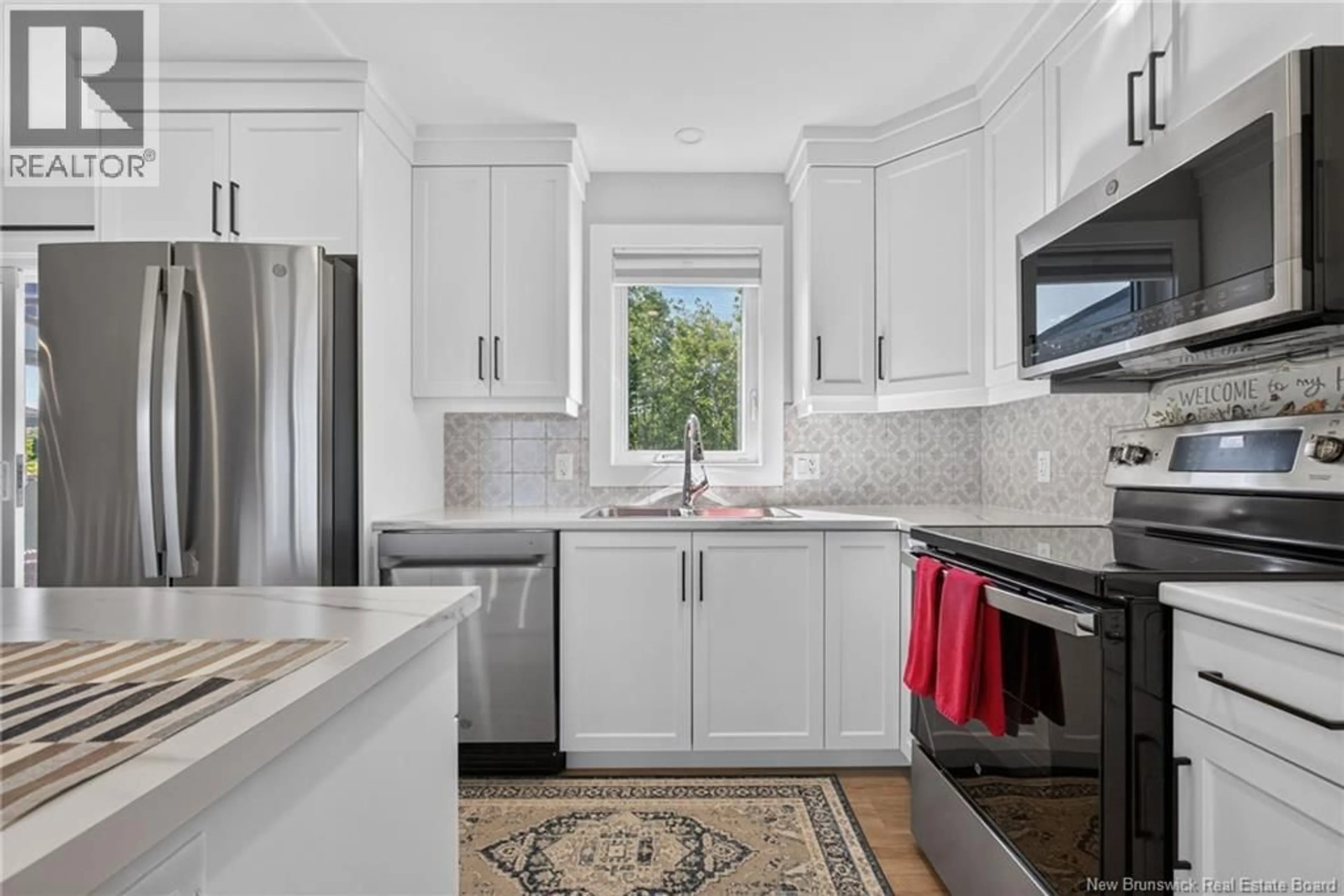 Open concept kitchen, ceramic/tile floor for 303 CHATELLERAULT STREET, Shediac New Brunswick E4P0L3