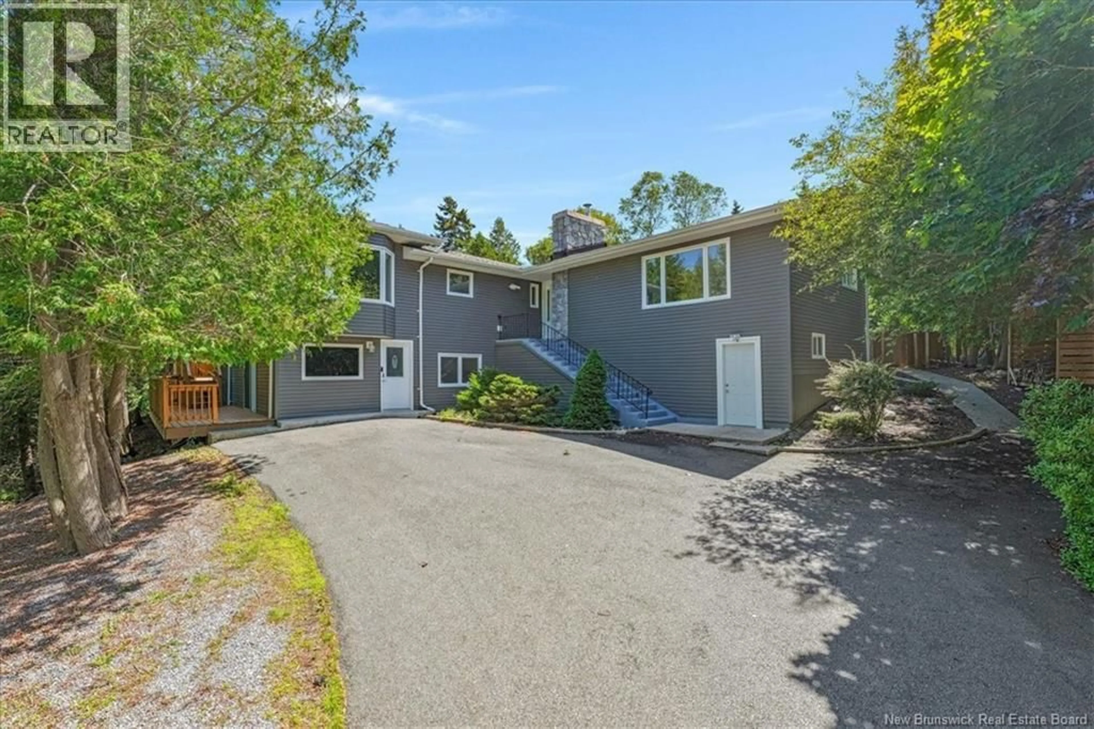 A pic from outside/outdoor area/front of a property/back of a property/a pic from drone, street for 100 KENNEBECASIS DRIVE, Saint John New Brunswick E2K2G1