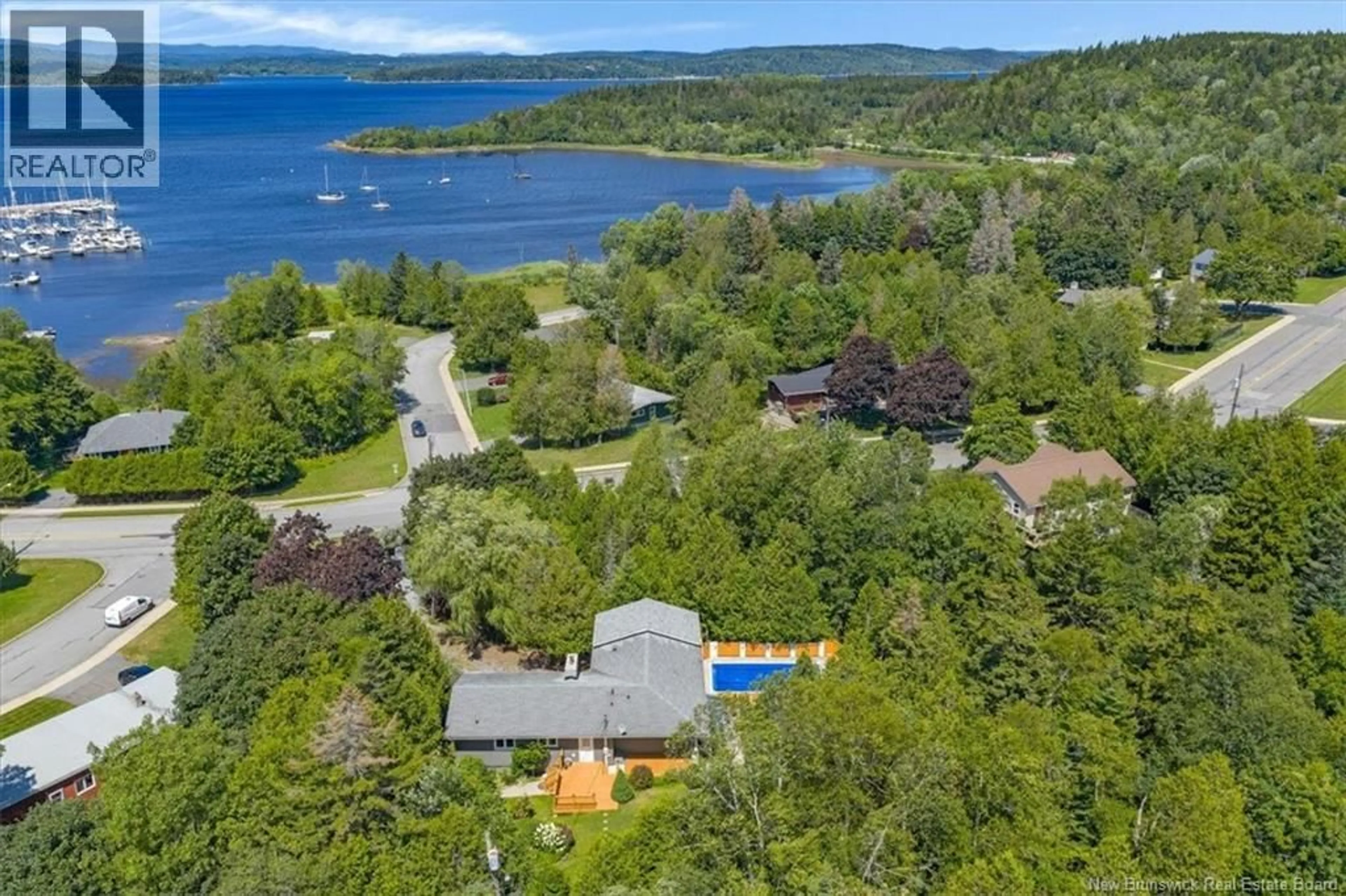 A pic from outside/outdoor area/front of a property/back of a property/a pic from drone, water/lake/river/ocean view for 100 KENNEBECASIS DRIVE, Saint John New Brunswick E2K2G1