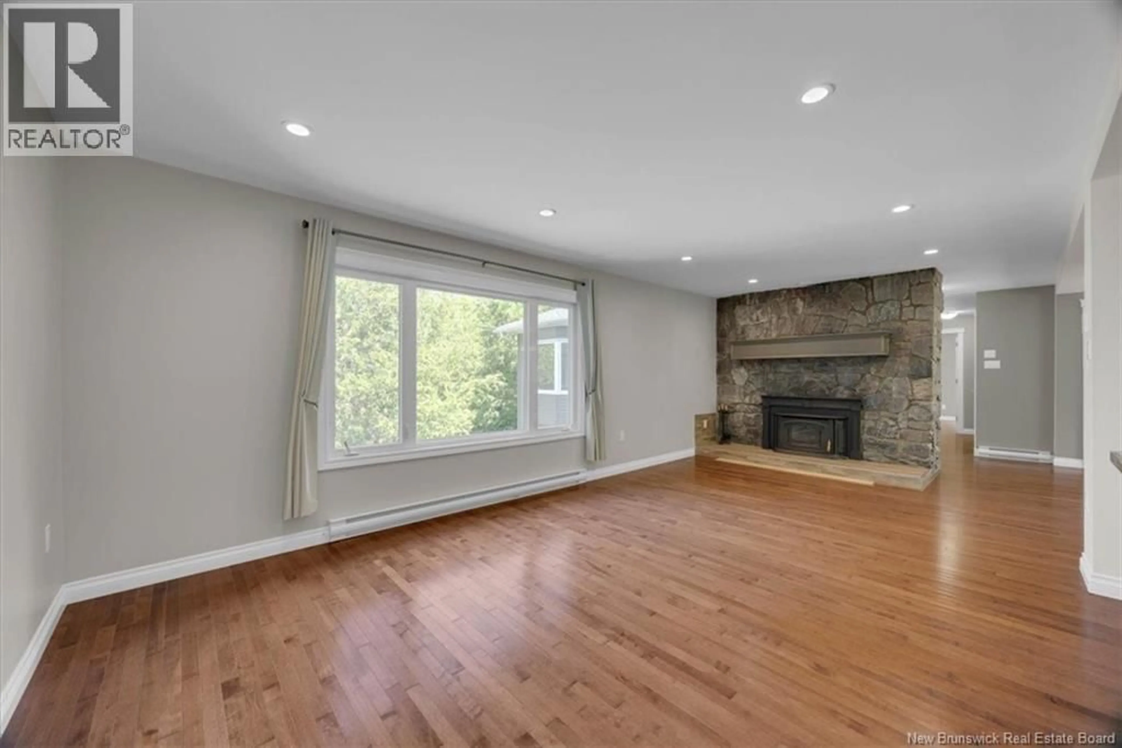 Living room with furniture, wood/laminate floor for 100 KENNEBECASIS DRIVE, Saint John New Brunswick E2K2G1
