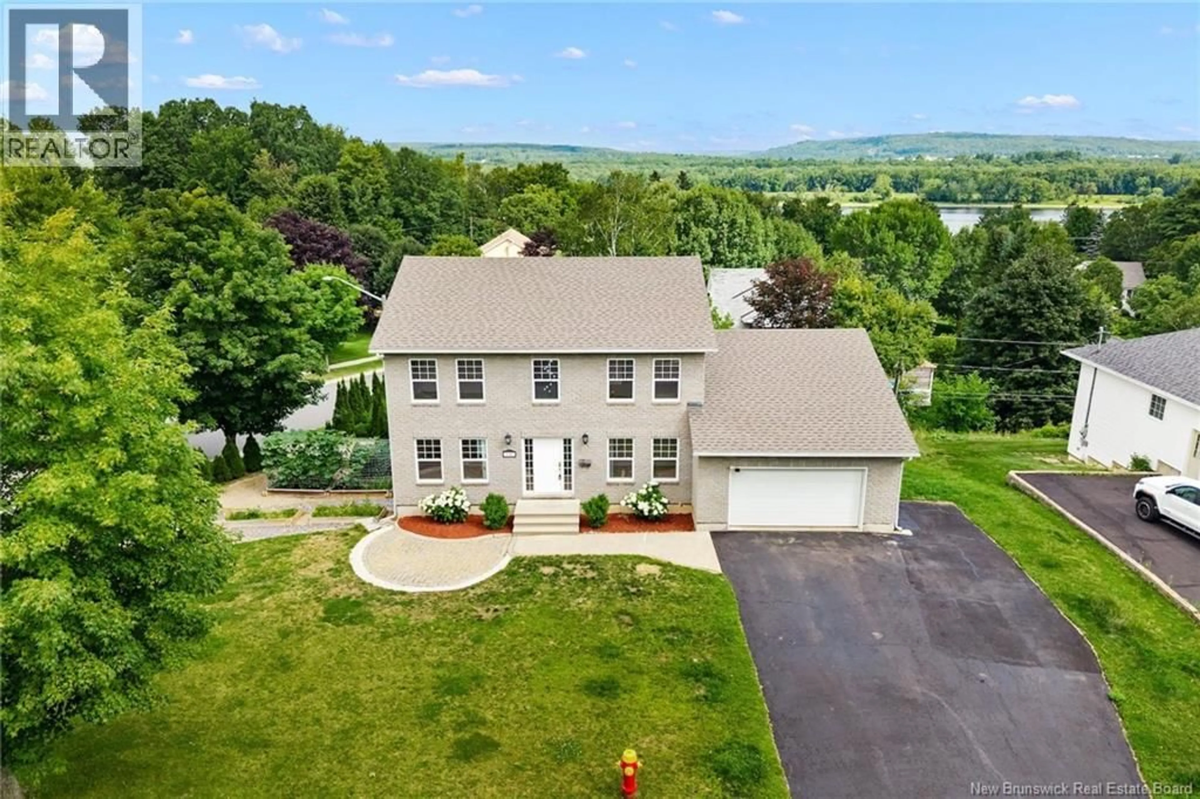 A pic from outside/outdoor area/front of a property/back of a property/a pic from drone, unknown for 145 COBURN COURT, Fredericton New Brunswick E3B7A6
