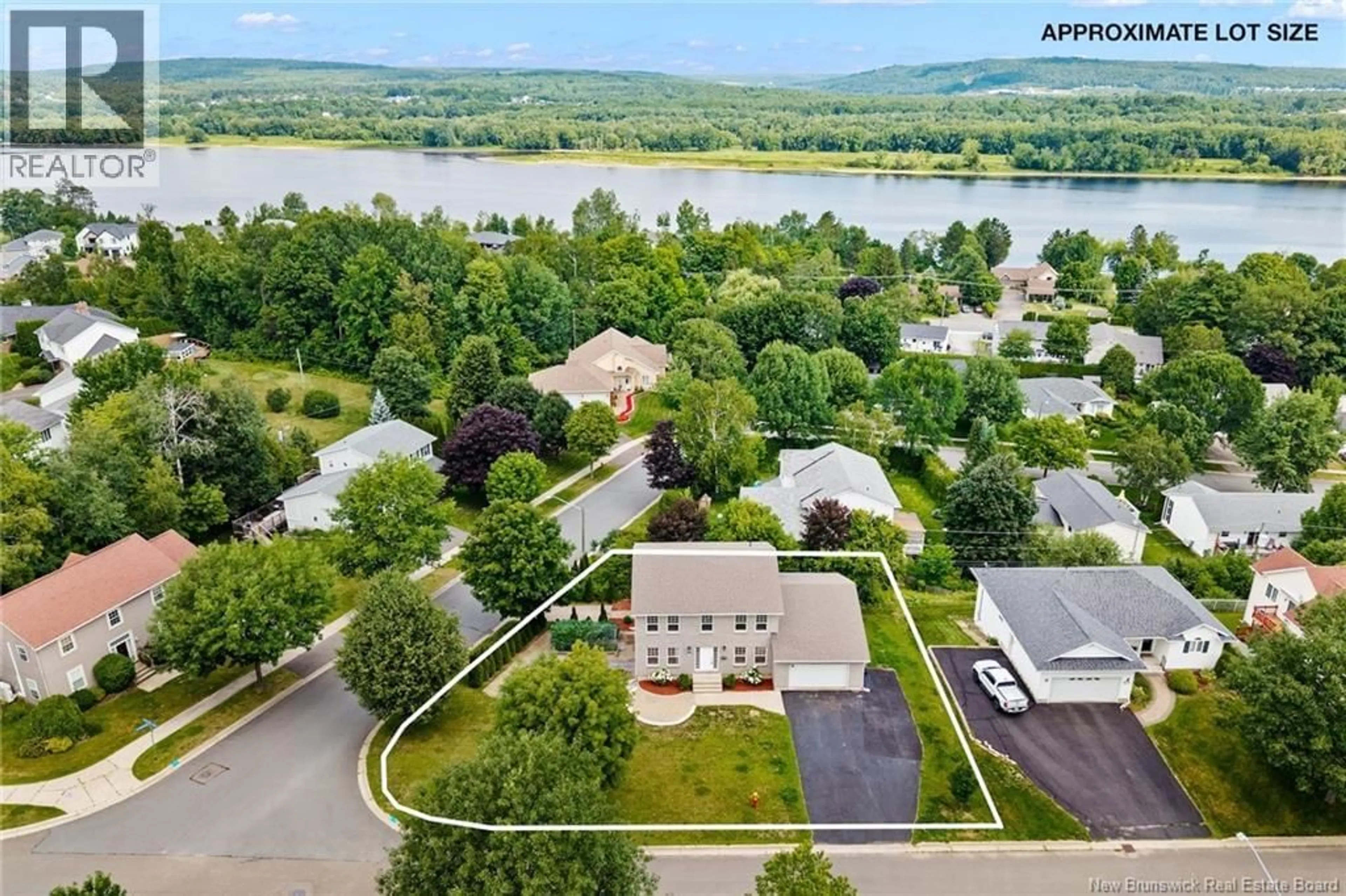A pic from outside/outdoor area/front of a property/back of a property/a pic from drone, water/lake/river/ocean view for 145 COBURN COURT, Fredericton New Brunswick E3B7A6