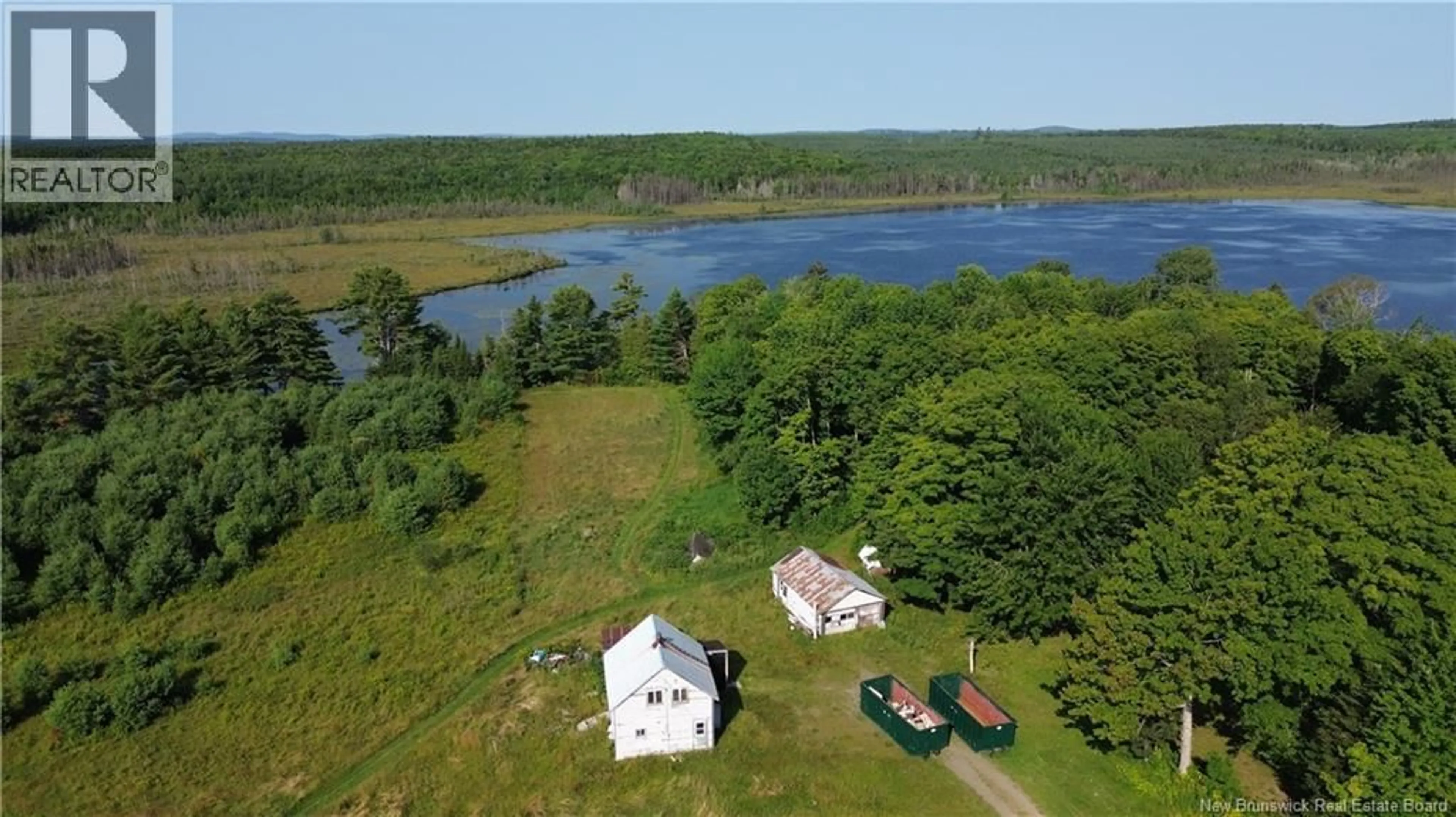 A pic from outside/outdoor area/front of a property/back of a property/a pic from drone, water/lake/river/ocean view for 2635 595 ROUTE, Bull Lake New Brunswick E7N4E4