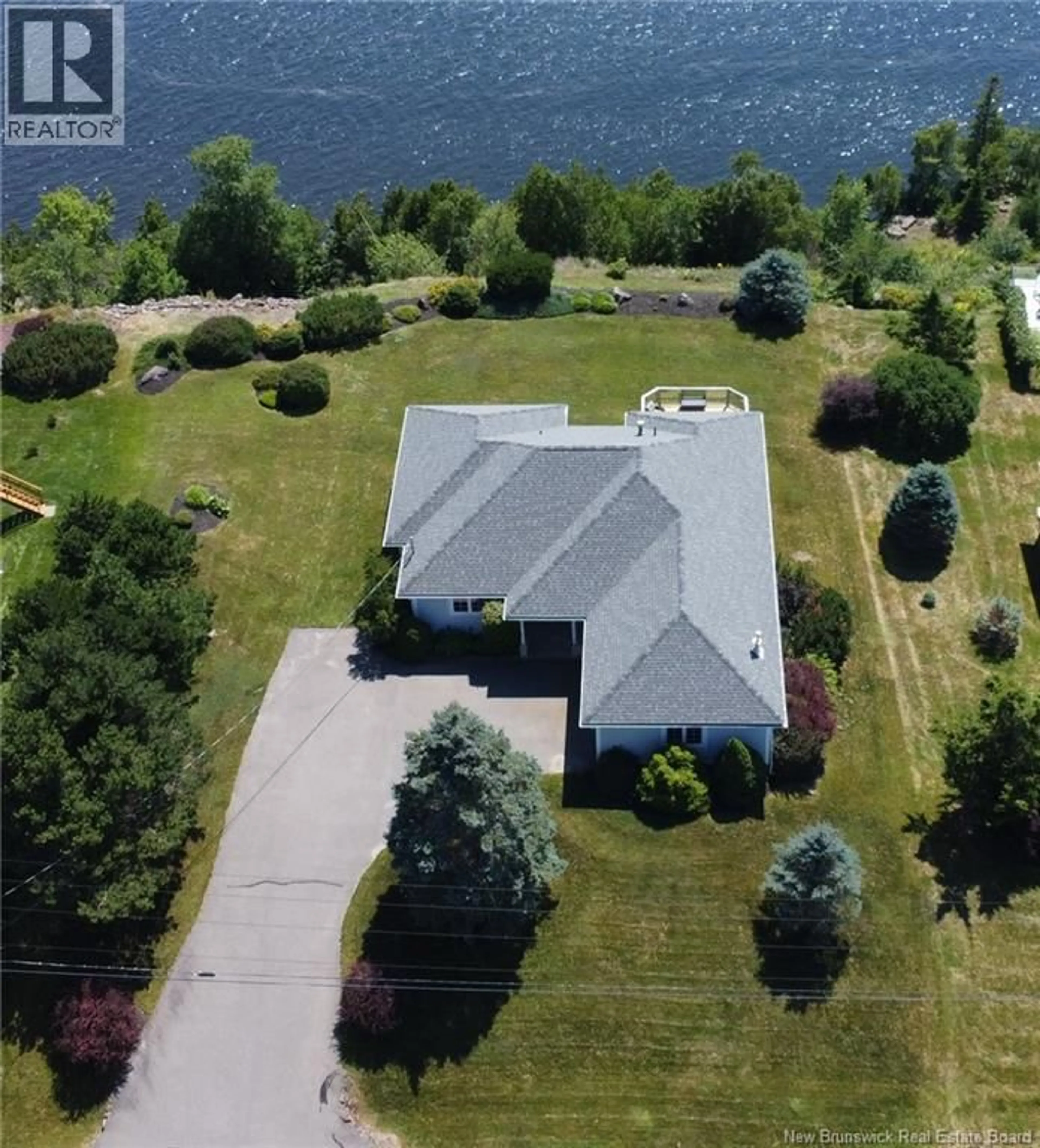 A pic from outside/outdoor area/front of a property/back of a property/a pic from drone, water/lake/river/ocean view for 91 RIVERSHORE DRIVE, Saint John New Brunswick E2K4X4