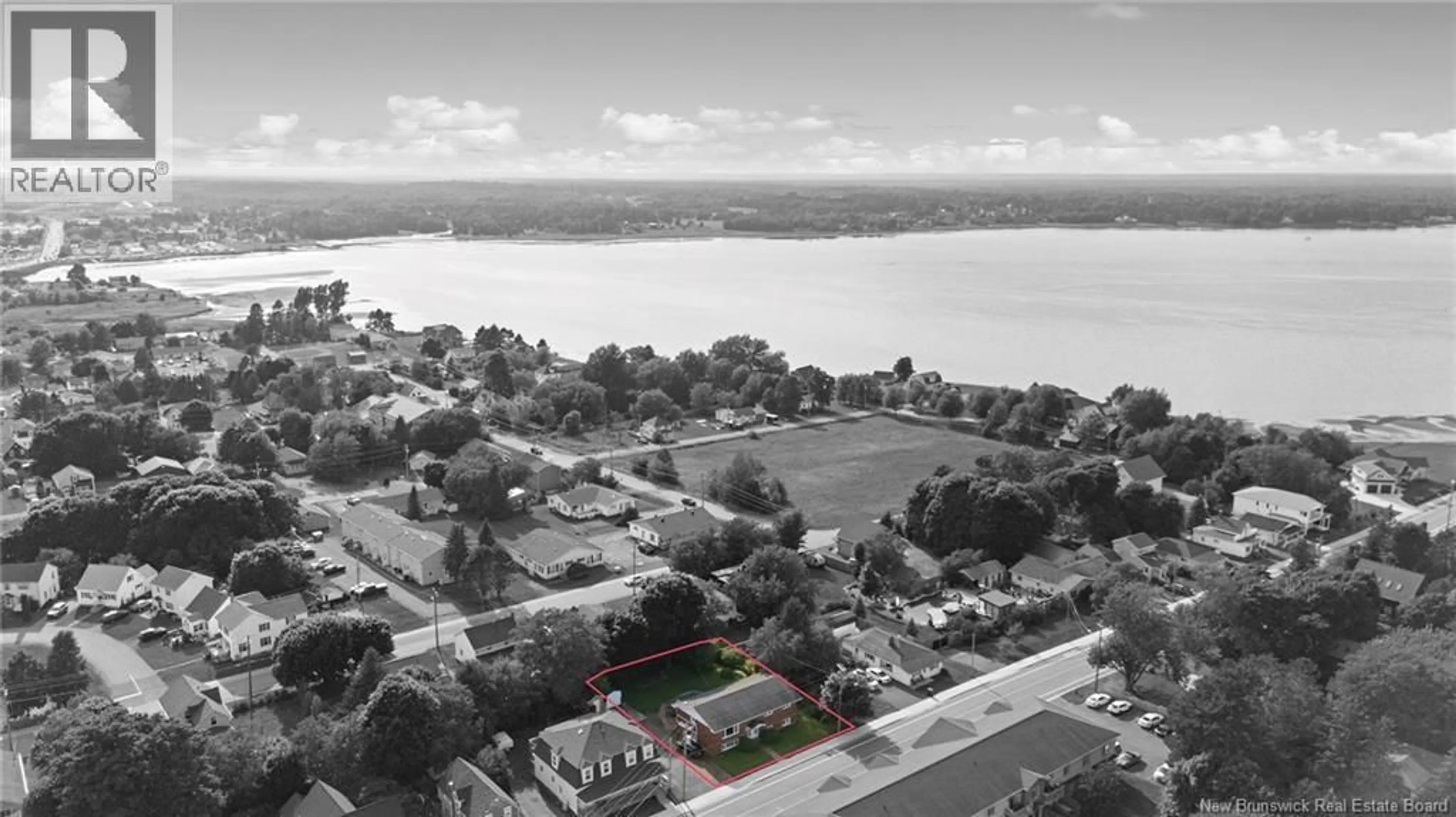 A pic from outside/outdoor area/front of a property/back of a property/a pic from drone, water/lake/river/ocean view for 95-97 PLEASANT STREET, Shediac New Brunswick E4P2L6