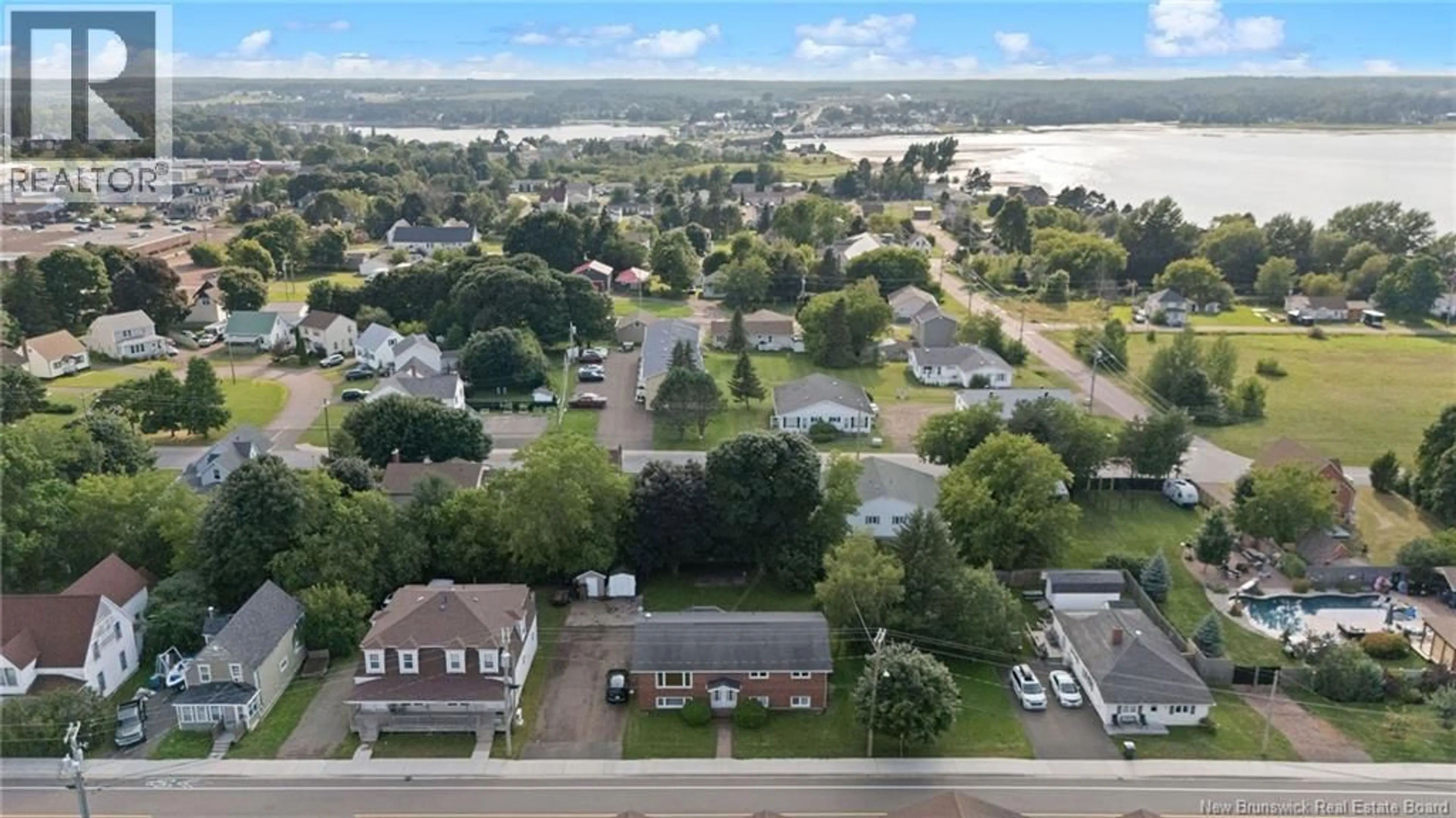 A pic from outside/outdoor area/front of a property/back of a property/a pic from drone, water/lake/river/ocean view for 95-97 PLEASANT STREET, Shediac New Brunswick E4P2L6