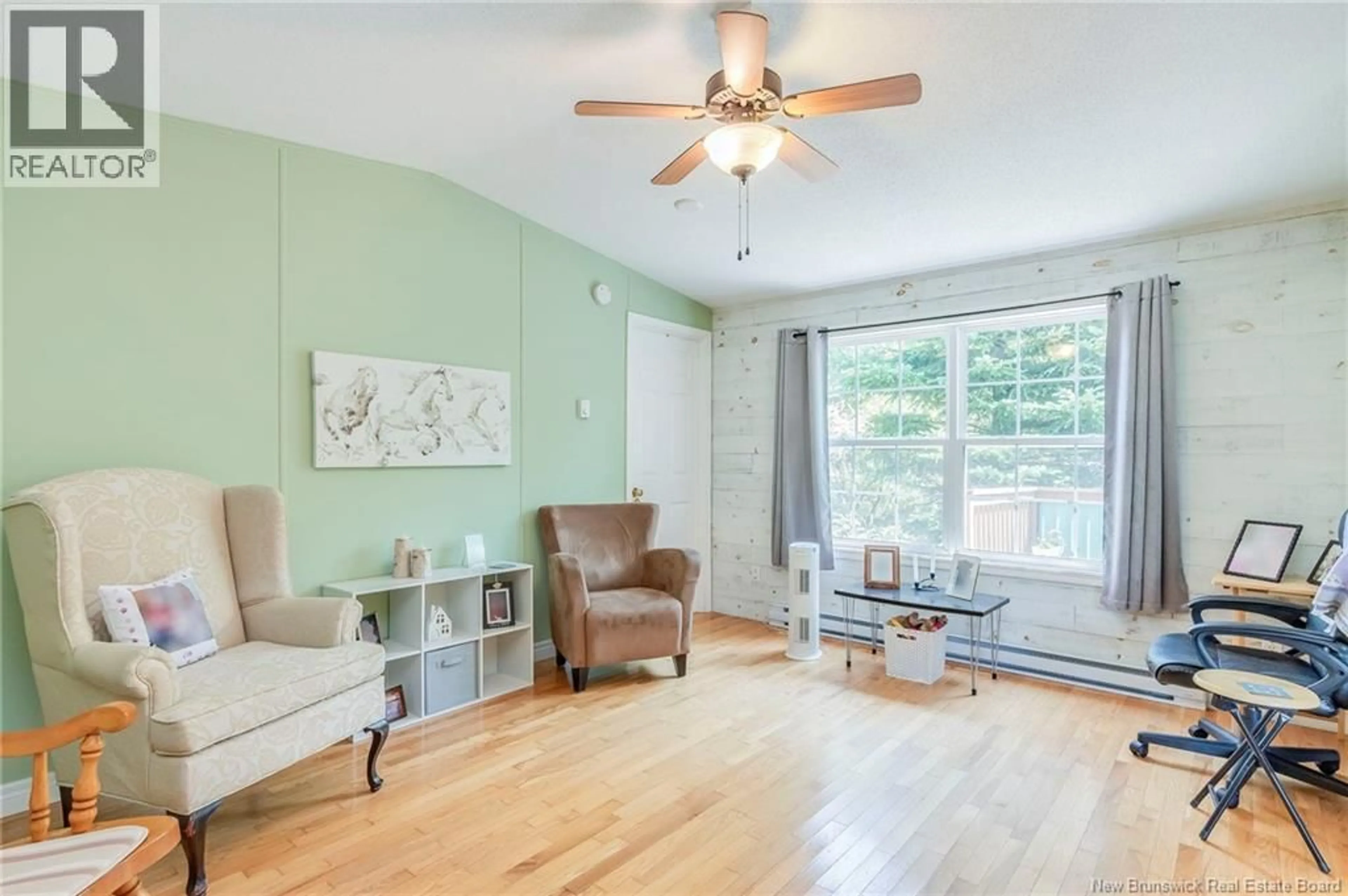 Living room with furniture, wood/laminate floor for 61 IRONWOOD, Quispamsis New Brunswick E2G1X6