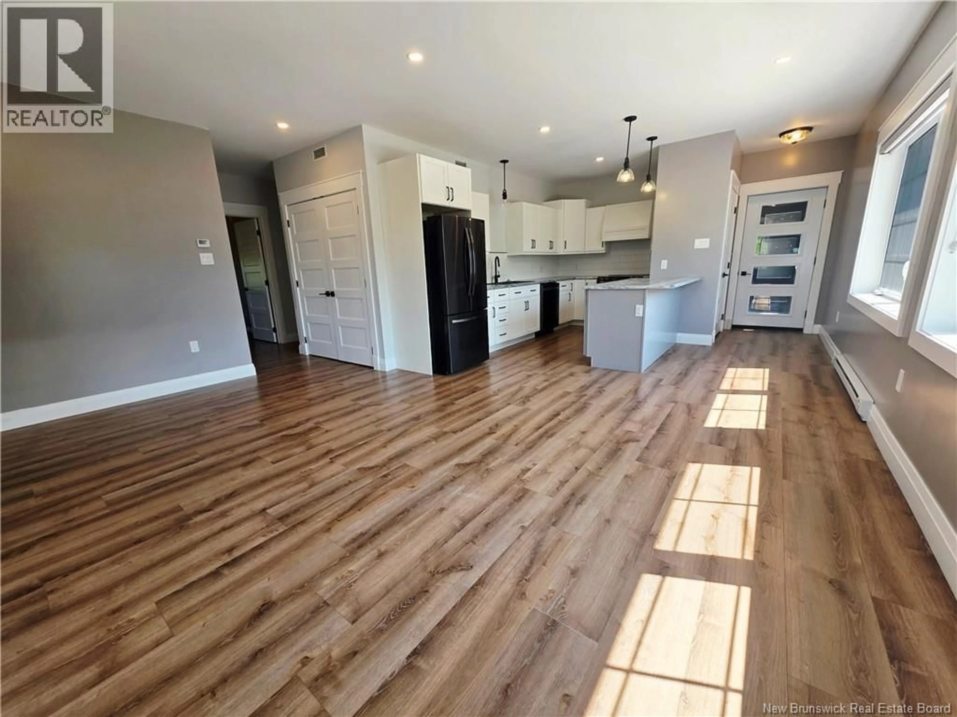 Open concept kitchen, wood/laminate floor for 201 - 24 RIVERVIEW DRIVE, Somerville New Brunswick E7P3B4