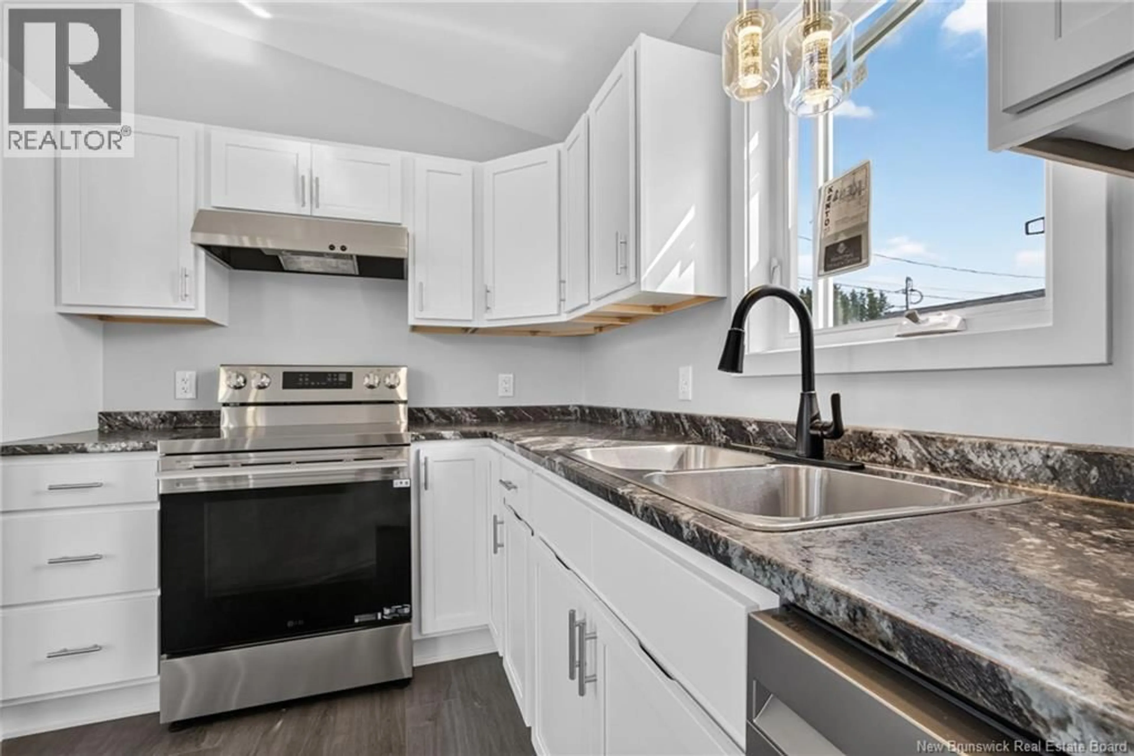 Open concept kitchen, ceramic/tile floor for 15 CAROLYN CRESCENT, Moncton New Brunswick E1E3T6