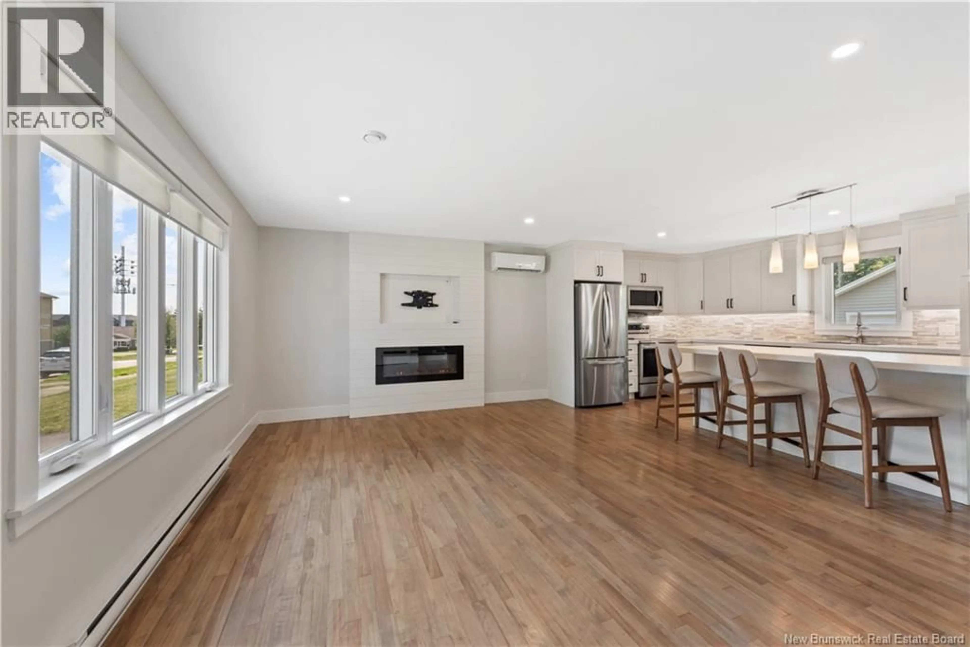 Open concept kitchen, wood/laminate floor for 57 UPLAND ROAD, Moncton New Brunswick E1G1K4