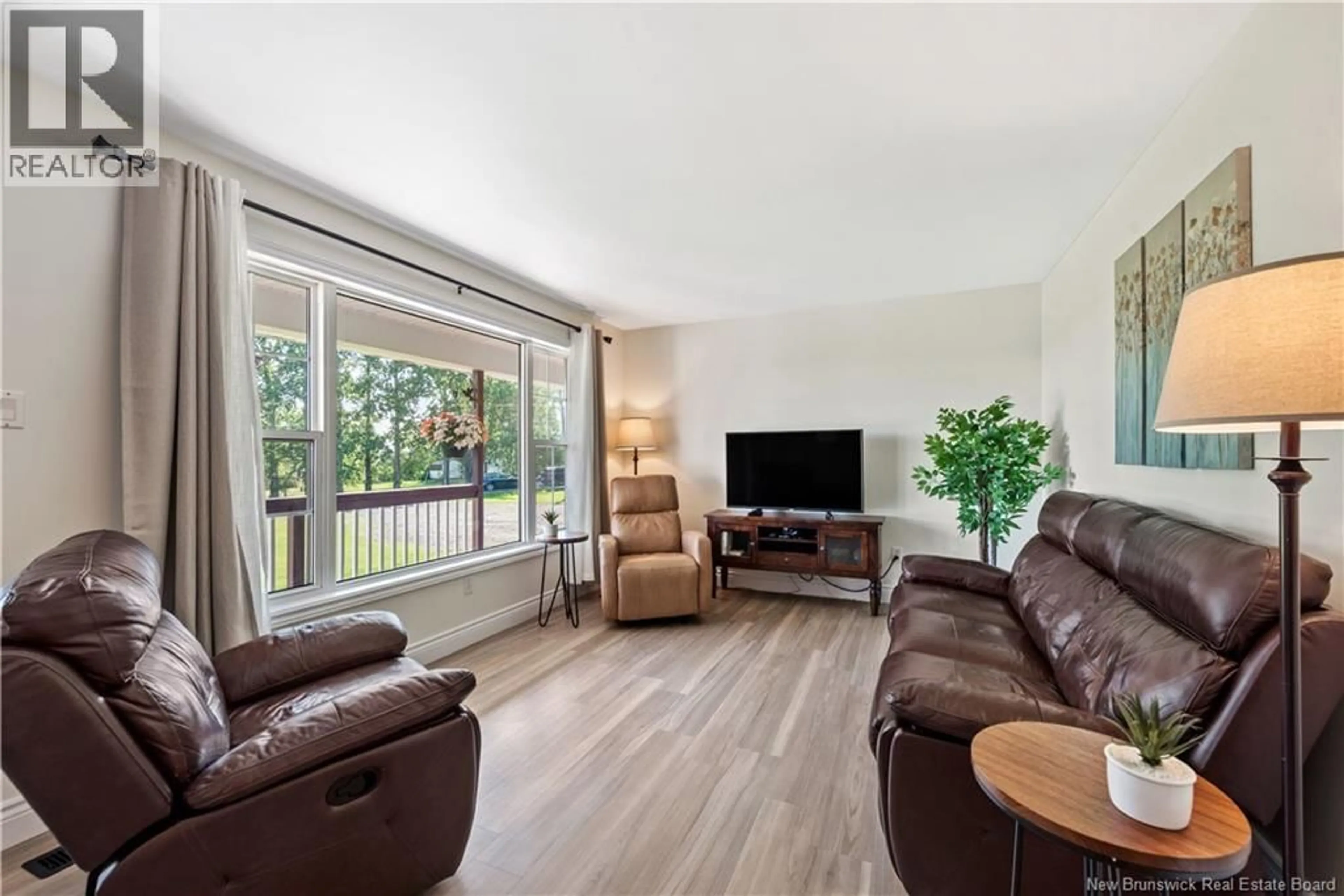 Living room with furniture, wood/laminate floor for 21 OSPREY ROAD, Upper Coverdale New Brunswick E1J1T7