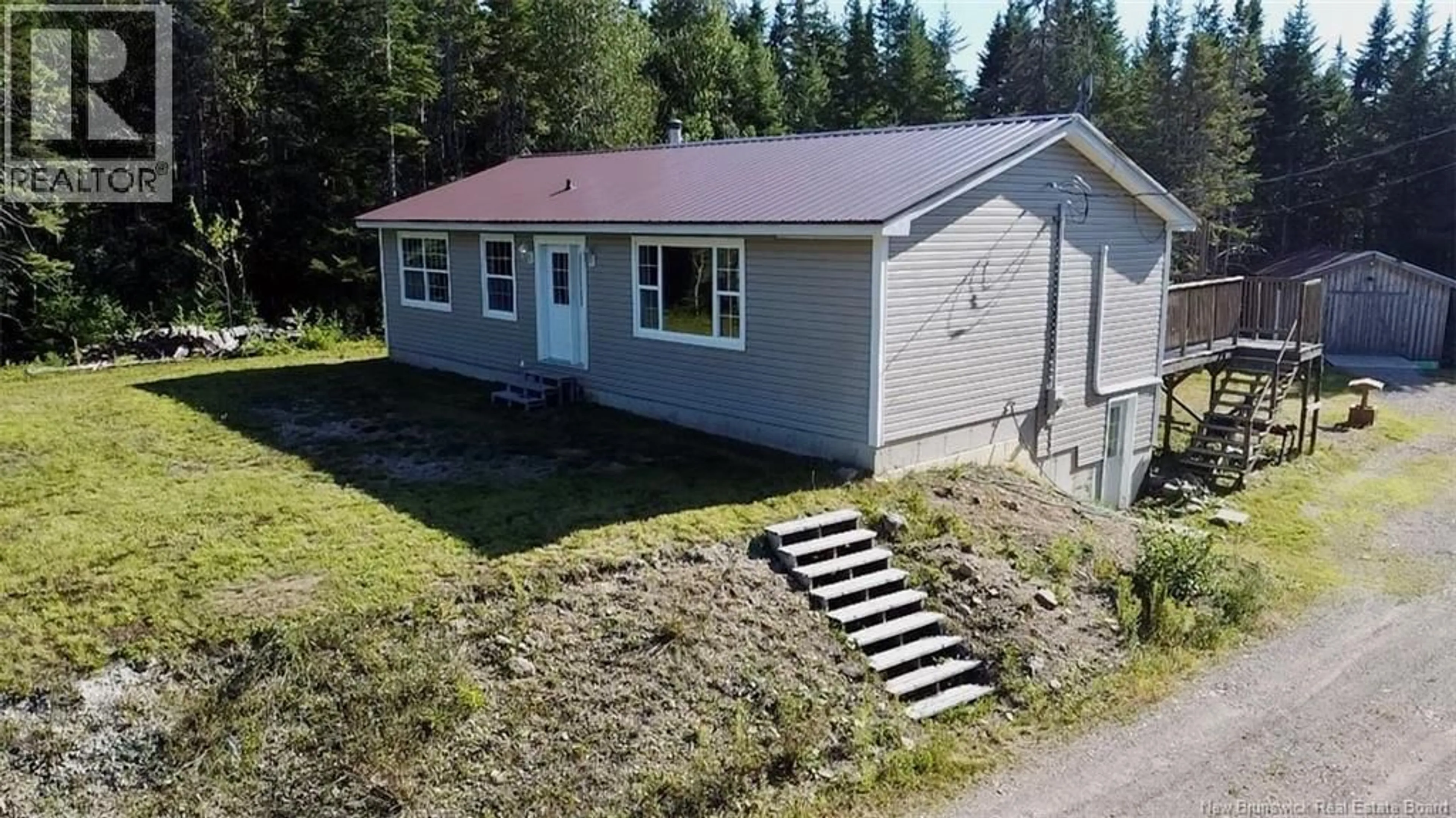 A pic from outside/outdoor area/front of a property/back of a property/a pic from drone, building for 101 WETMORE CREEK ROAD, Musquash New Brunswick E5J2L3