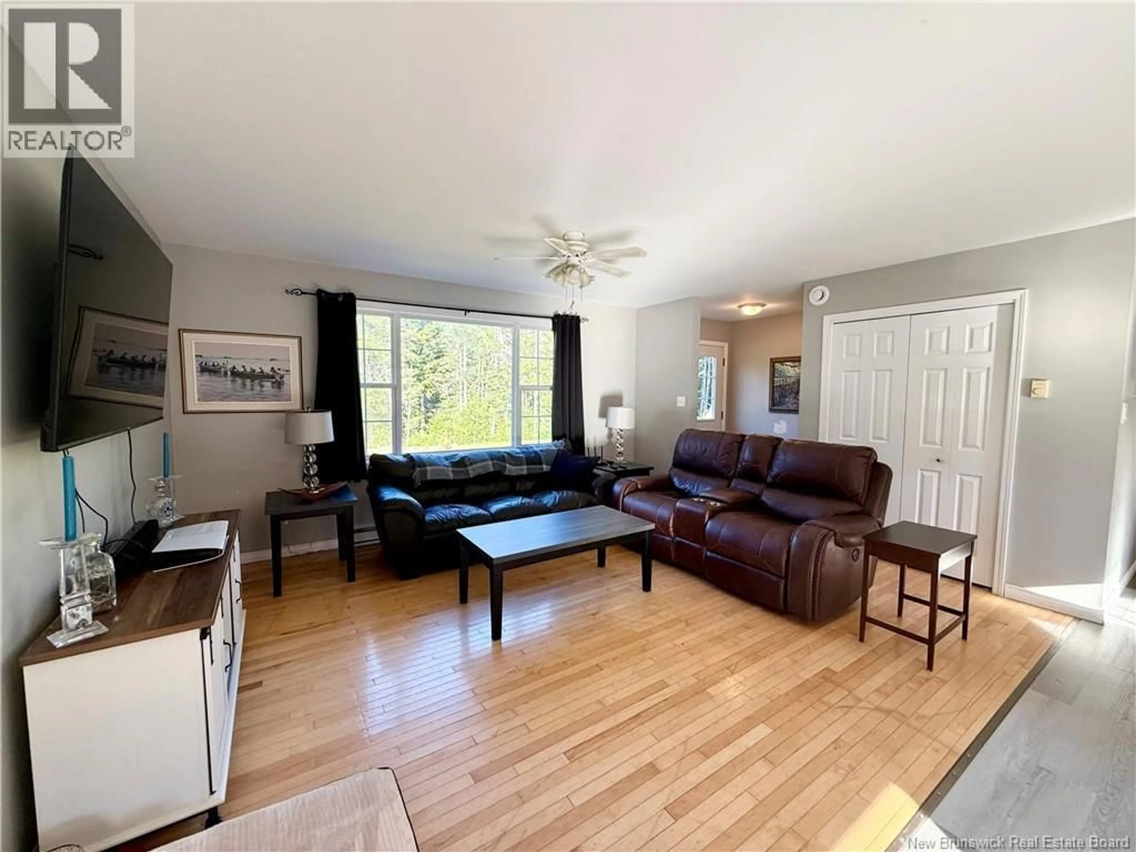 Living room with furniture, wood/laminate floor for 101 WETMORE CREEK ROAD, Musquash New Brunswick E5J2L3
