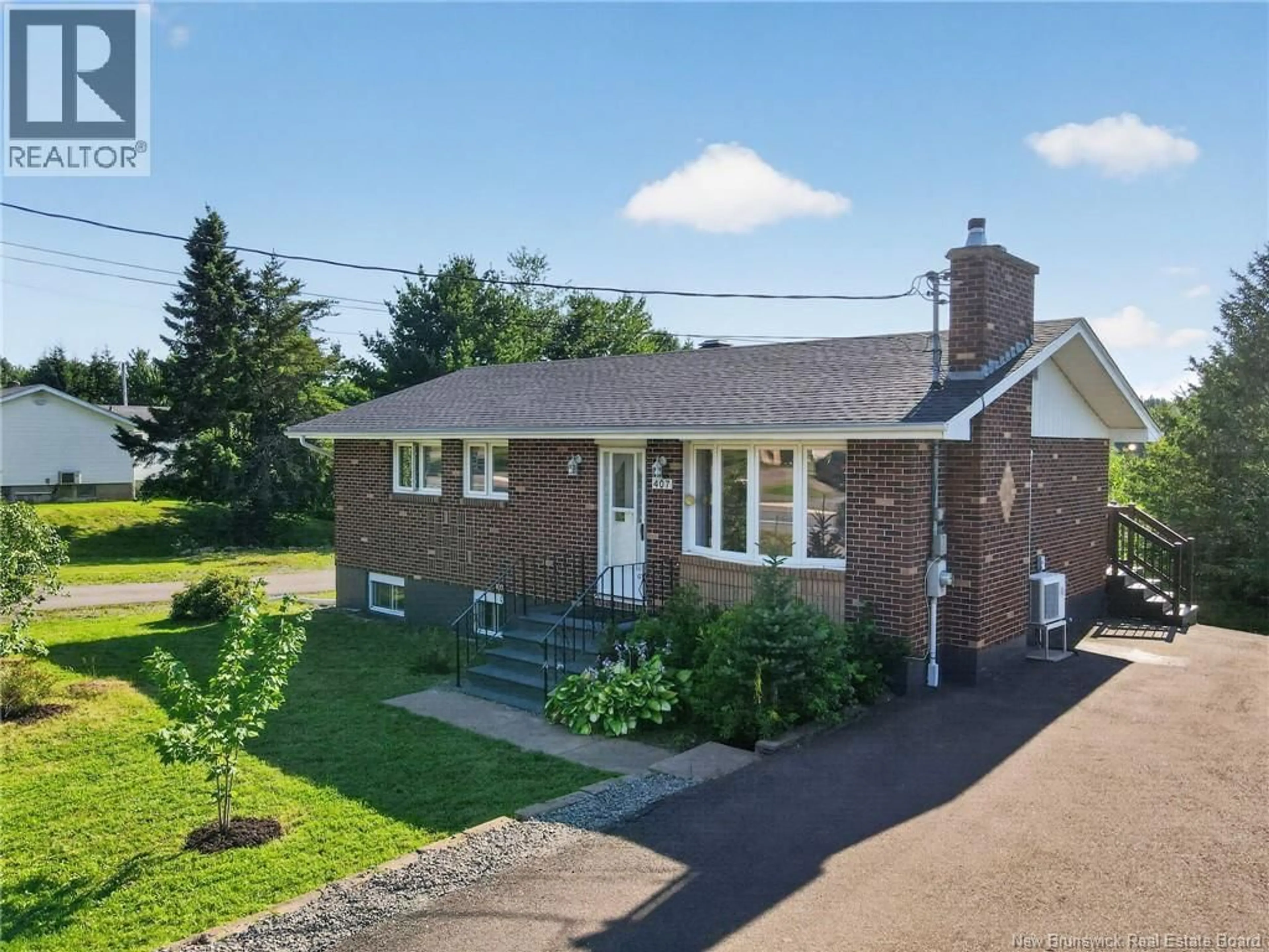 A pic from outside/outdoor area/front of a property/back of a property/a pic from drone, street for 407 FOX CREEK ROAD, Dieppe New Brunswick E1A7M5