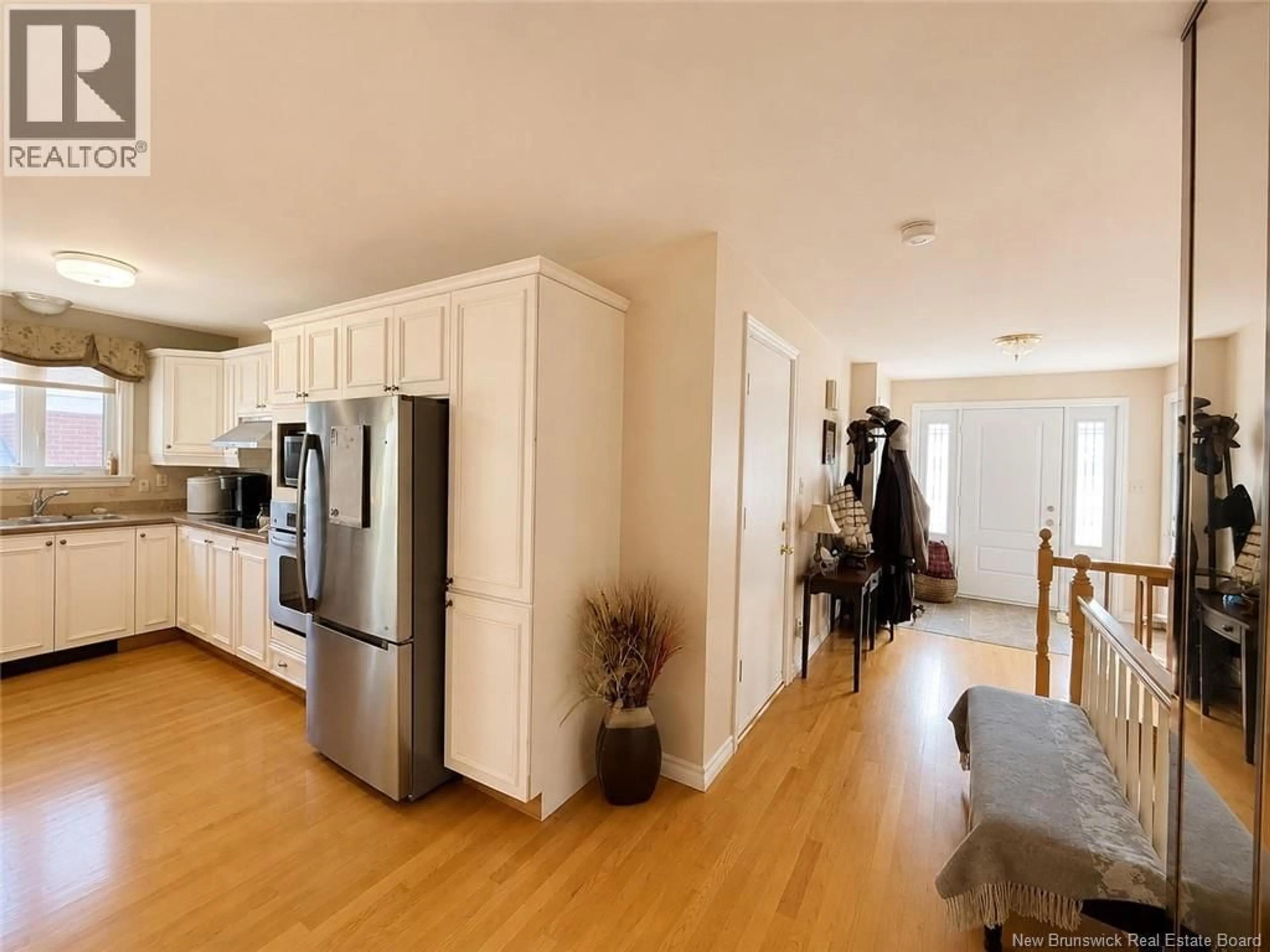 Open concept kitchen, wood/laminate floor for 29 LEBLOND STREET, Edmundston New Brunswick E3V4K9