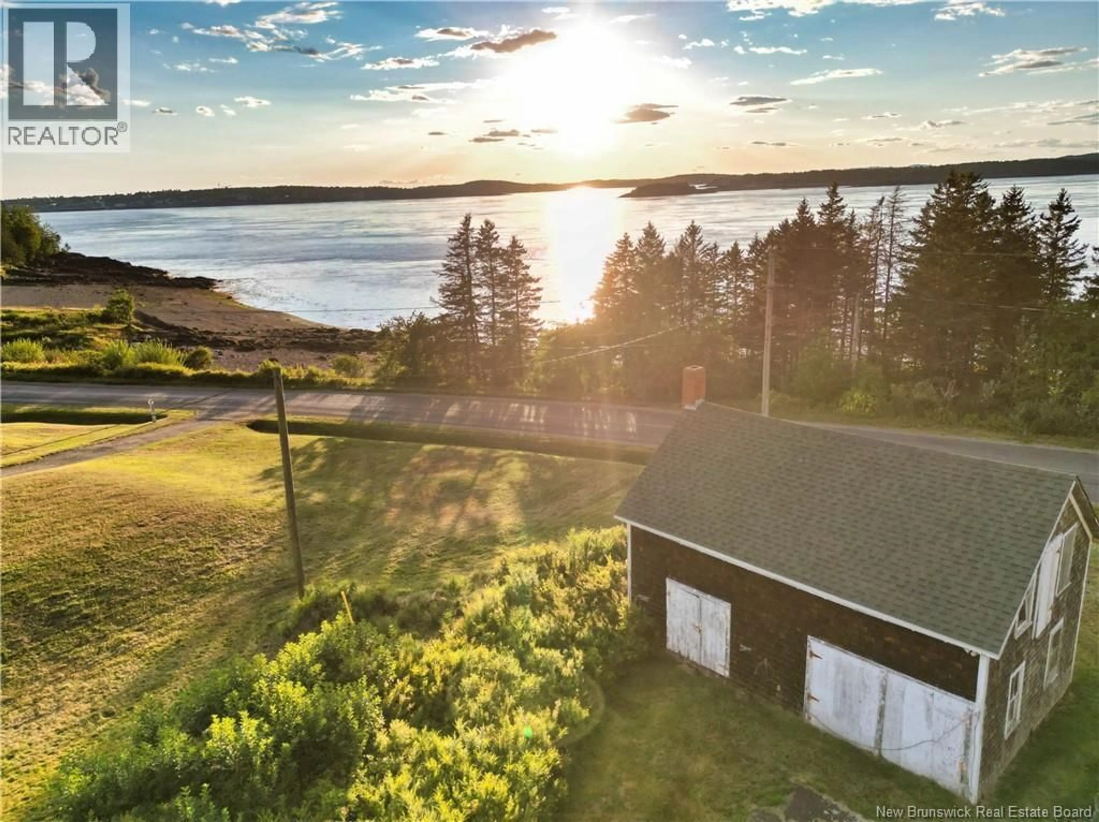 A pic from outside/outdoor area/front of a property/back of a property/a pic from drone, water/lake/river/ocean view for 744 NORTH ROAD, Welshpool New Brunswick E5E1E3