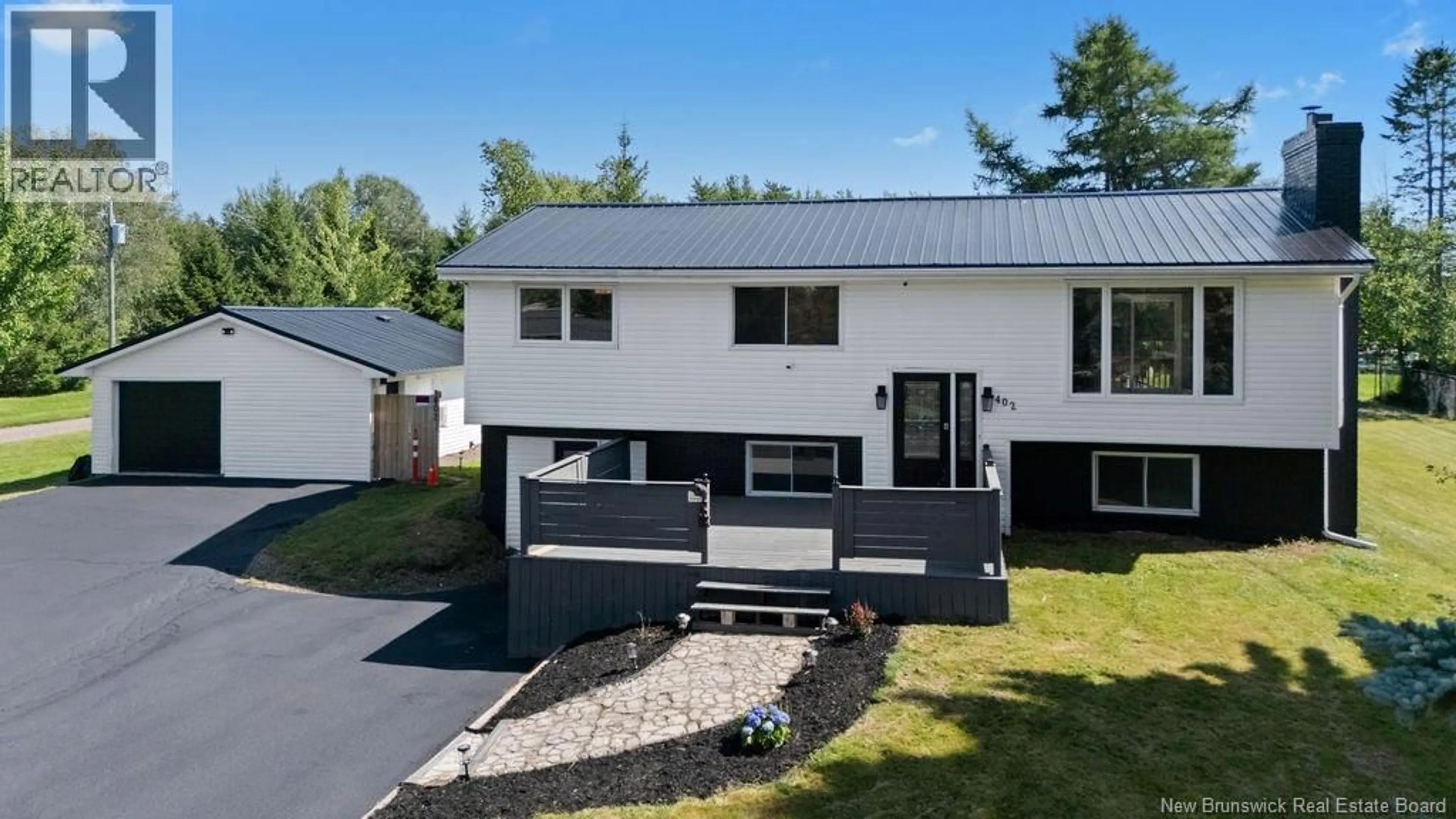 Home with vinyl exterior material, street for 402 MARGUERITE STREET, Dieppe New Brunswick E1A7H1