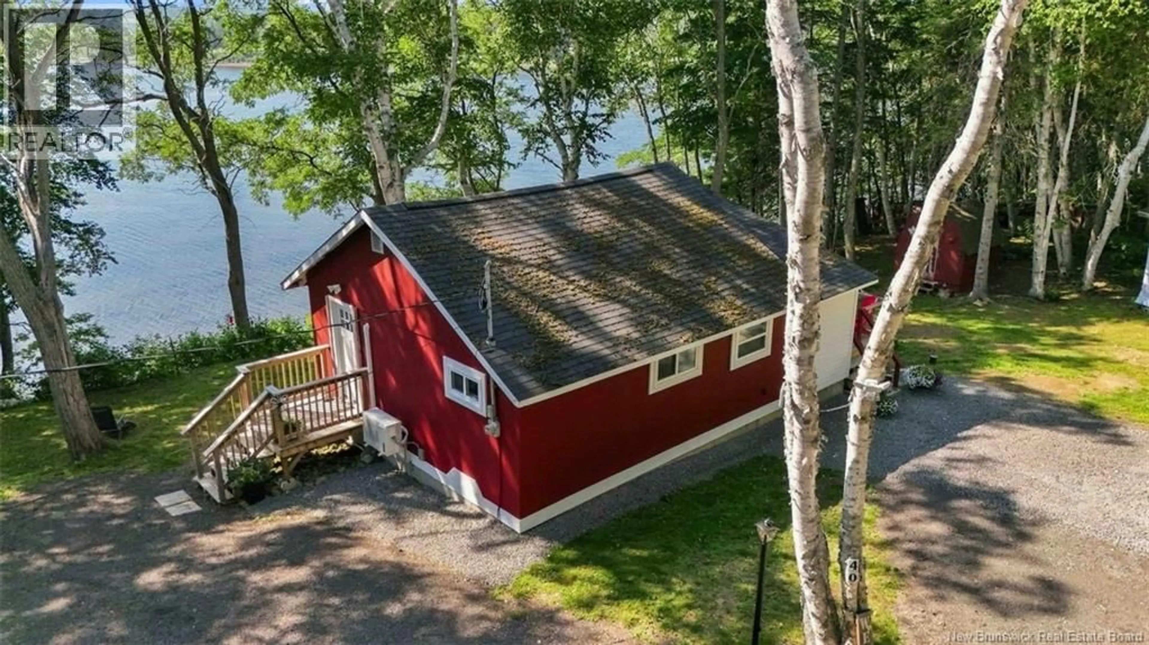 A pic from outside/outdoor area/front of a property/back of a property/a pic from drone, water/lake/river/ocean view for 40 COUNTRY LANE, McKees Mills New Brunswick E4V2R8