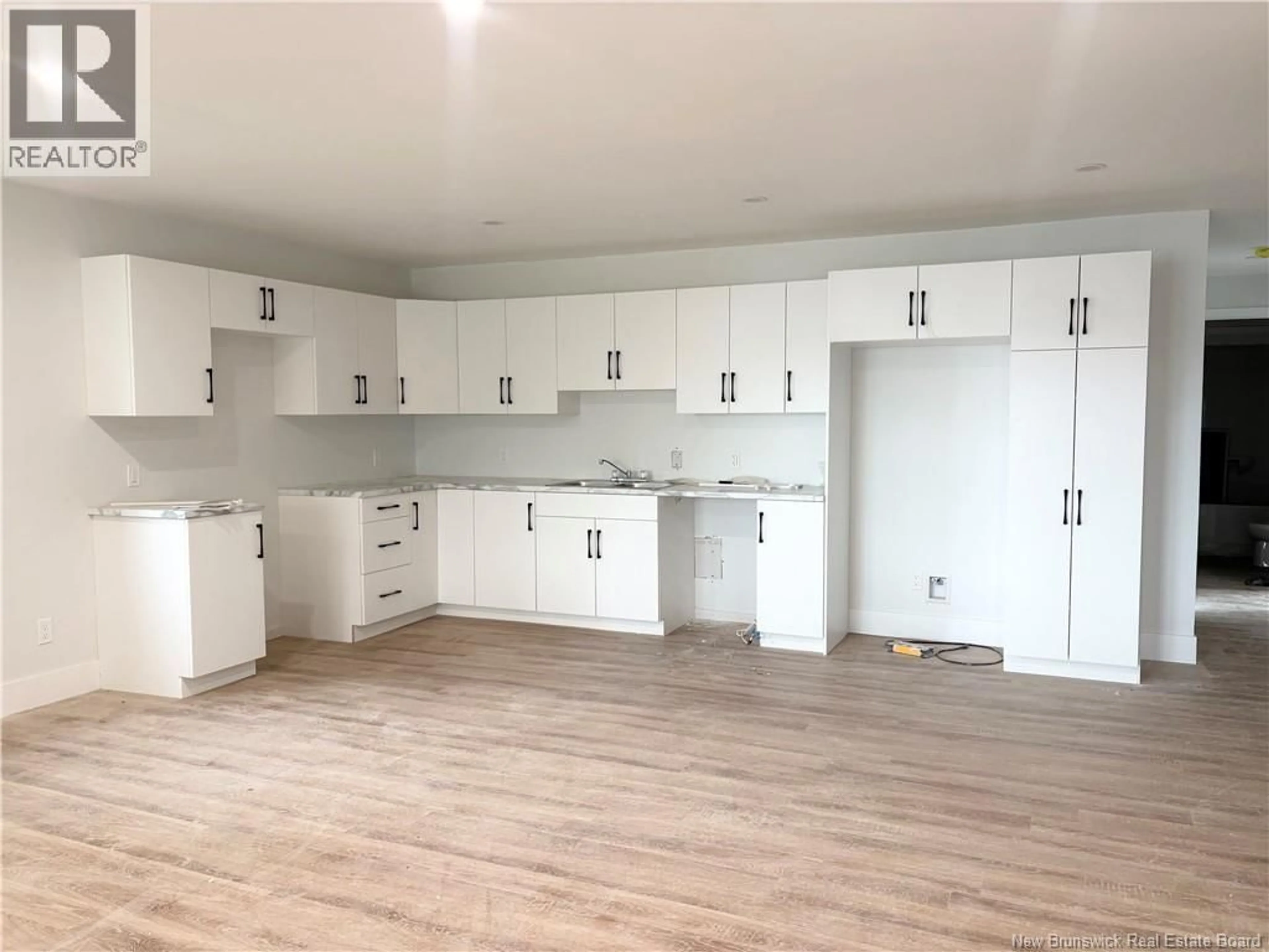 Open concept kitchen, wood/laminate floor for 66 CHATHAM AVENUE, Miramichi New Brunswick E1N2X9