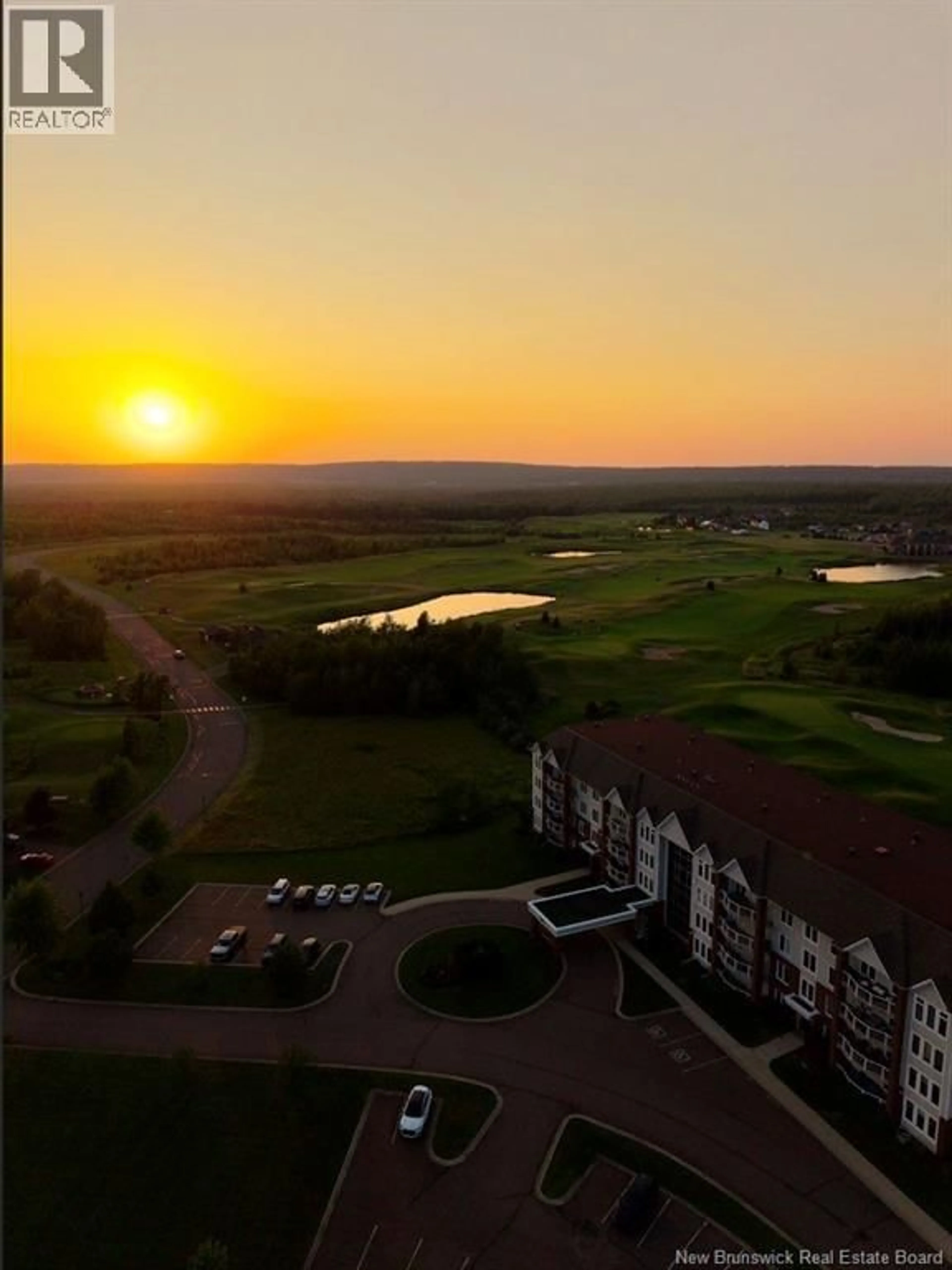 A pic from outside/outdoor area/front of a property/back of a property/a pic from drone, water/lake/river/ocean view for 210 - 185 ROYAL OAKS BOULEVARD, Moncton New Brunswick E1H2P7