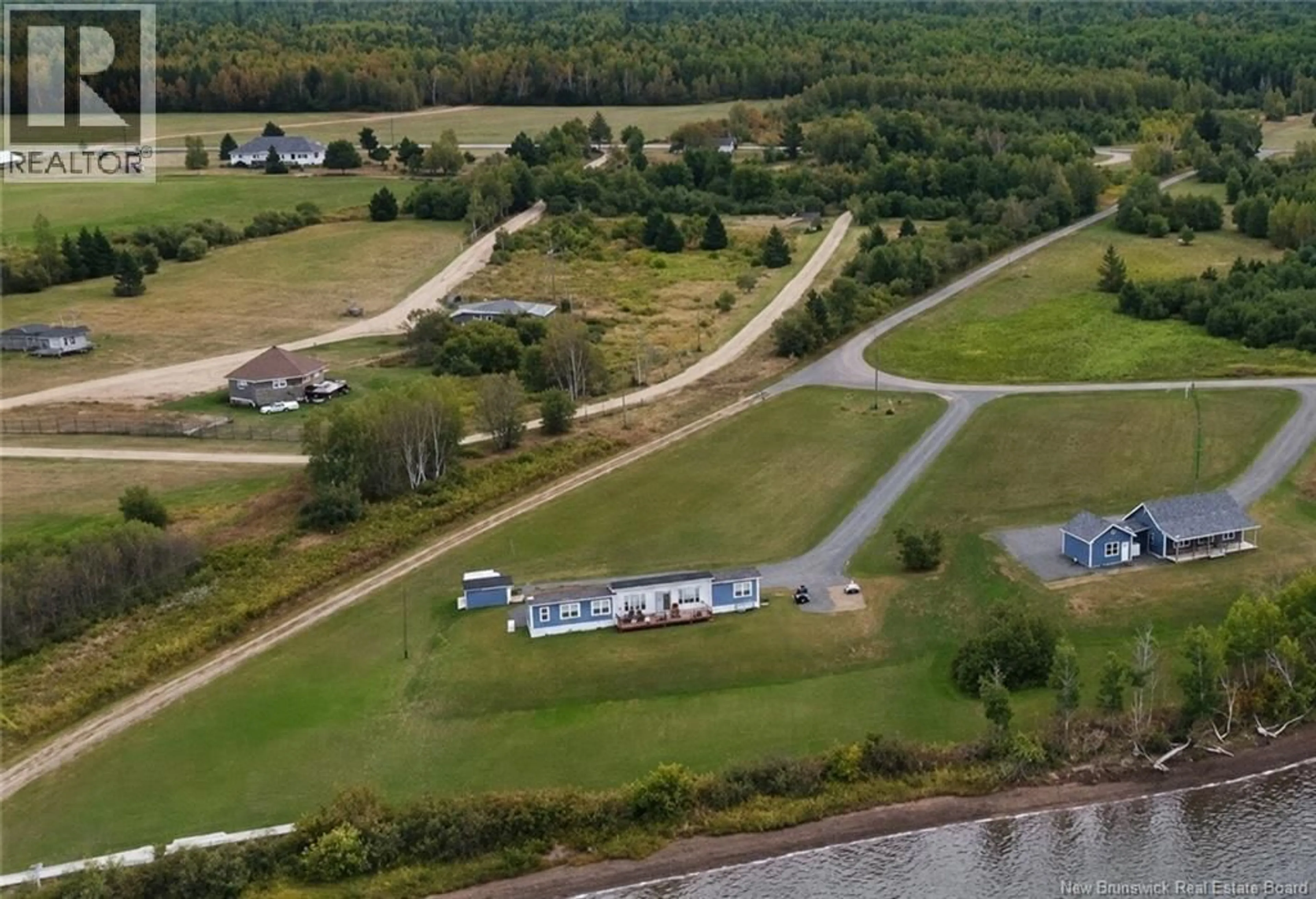 A pic from outside/outdoor area/front of a property/back of a property/a pic from drone, water/lake/river/ocean view for 30 MCKINNON, Main River New Brunswick E4T1T8