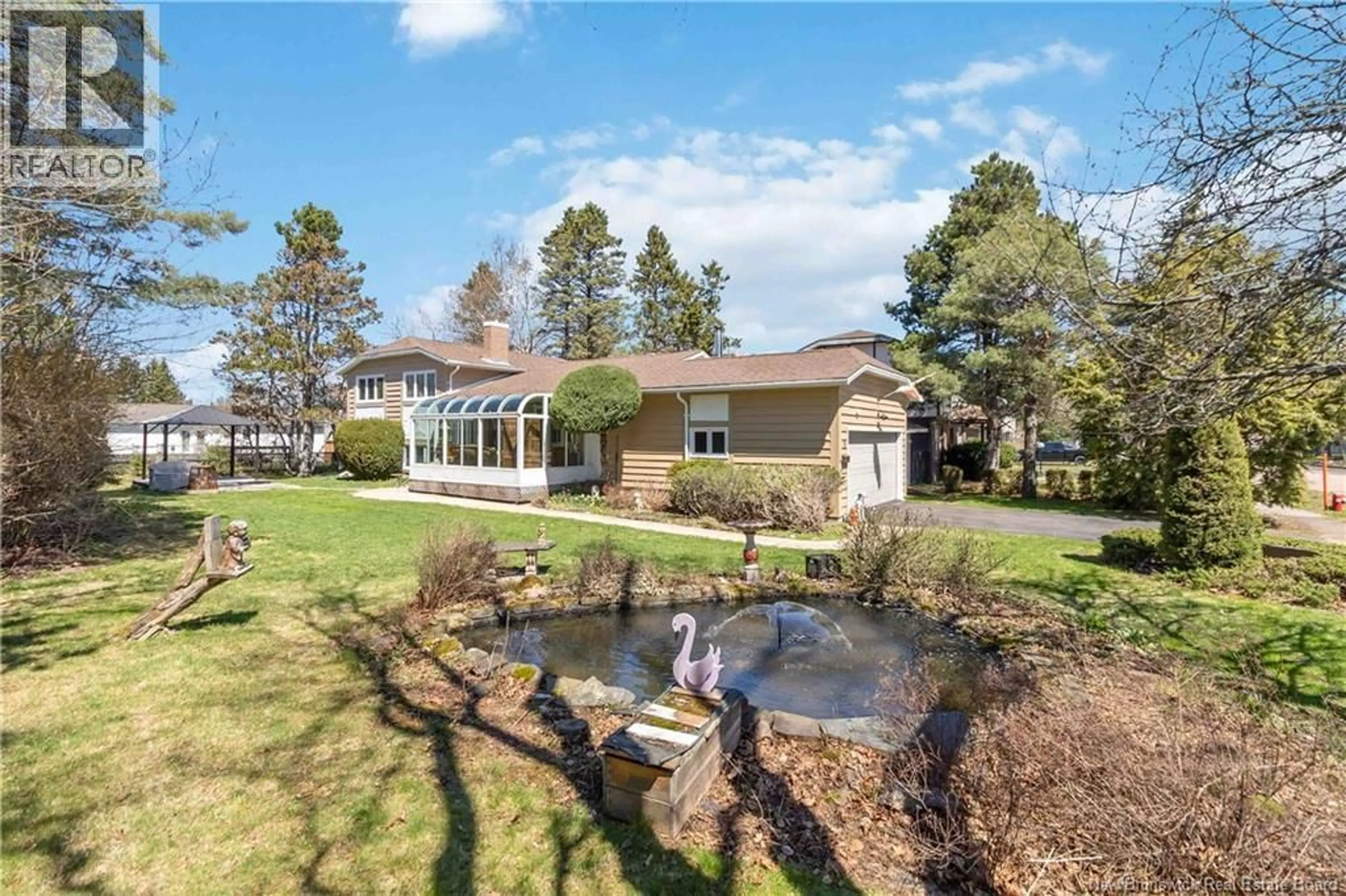 A pic from outside/outdoor area/front of a property/back of a property/a pic from drone, water/lake/river/ocean view for 35 FIRWOOD CRESCENT, Moncton New Brunswick E1A5W9
