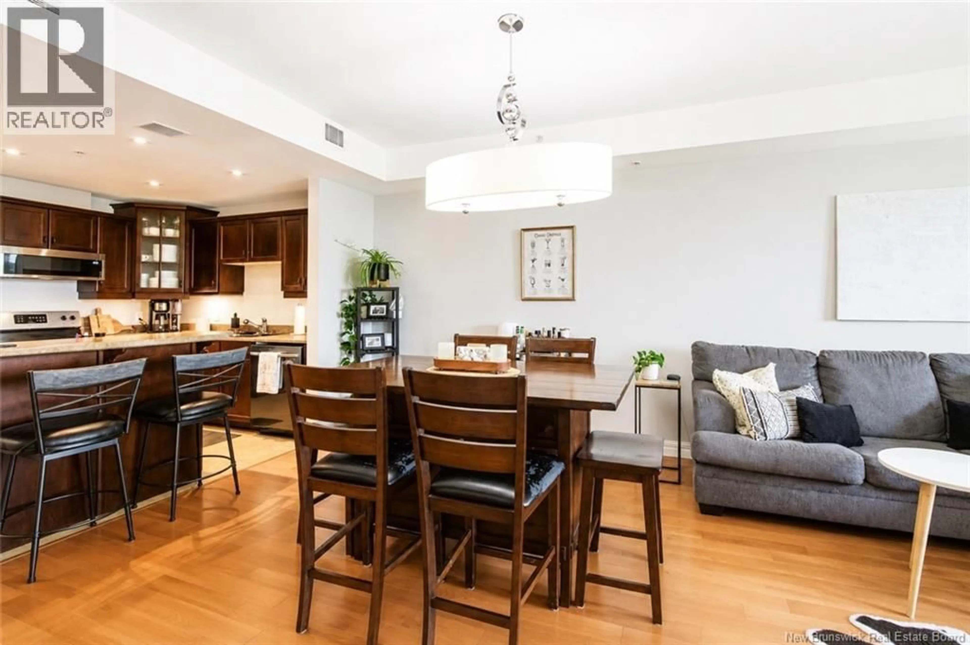 Open concept kitchen, wood/laminate floor for 206 - 185 ROYAL OAKS BOULEVARD, Moncton New Brunswick E1H2P7