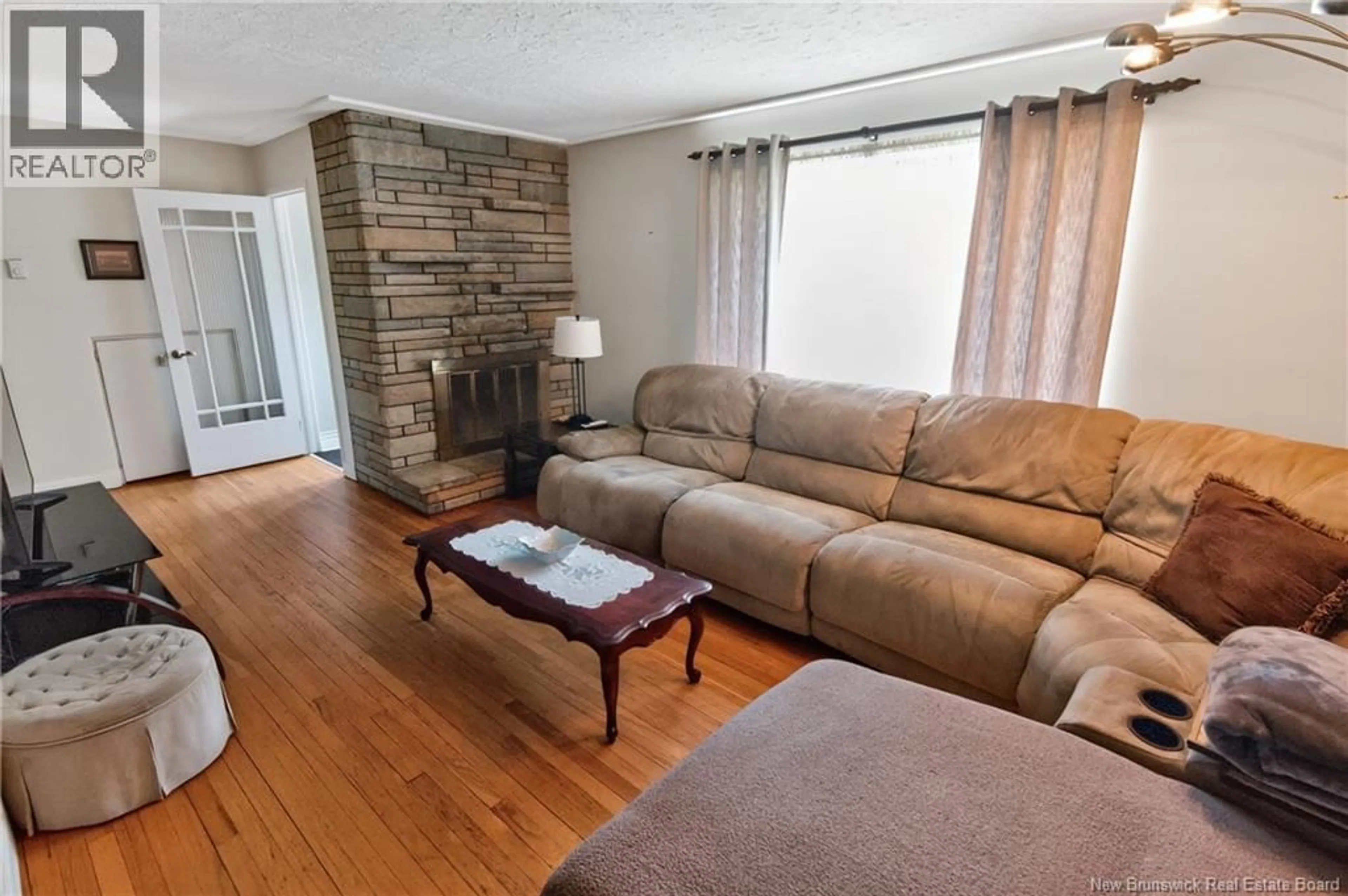 Living room with furniture, wood/laminate floor for 88 WALSH STREET, Moncton New Brunswick E1C6W8
