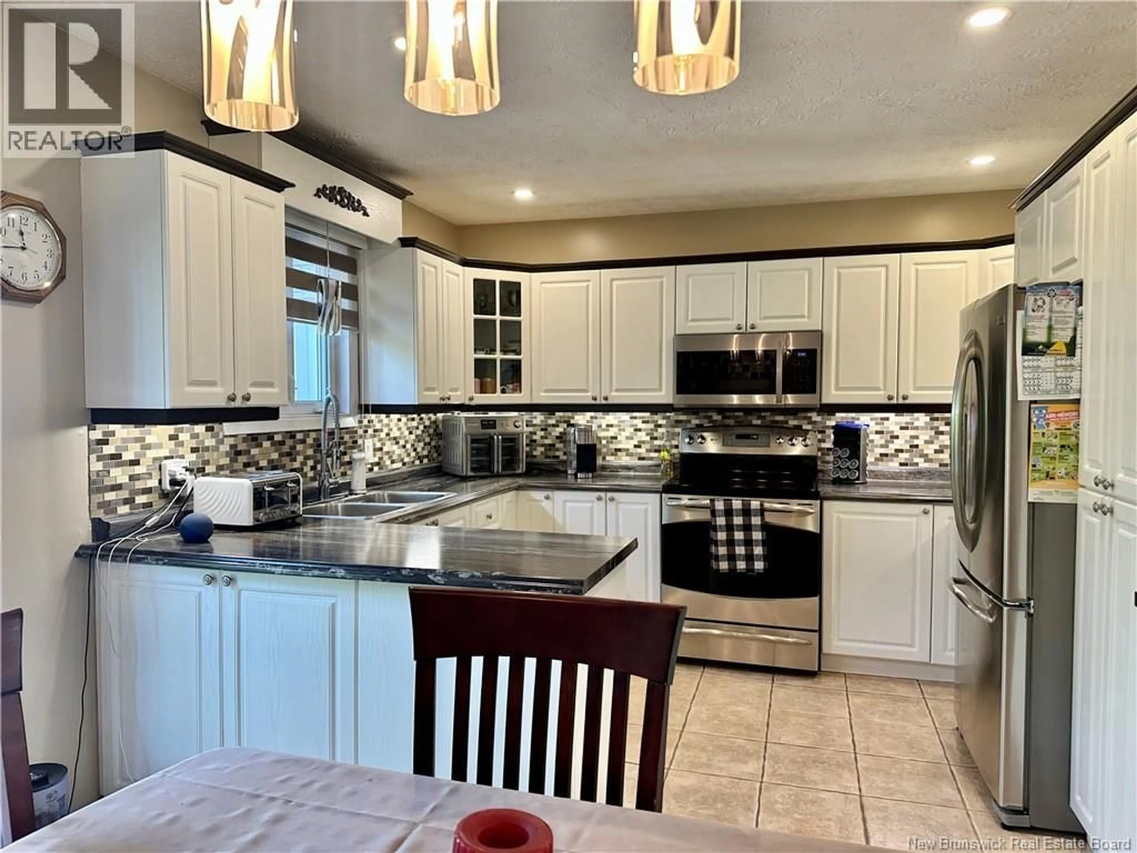 Open concept kitchen, ceramic/tile floor for 12 LÉONARD STREET, Saint-Jacques New Brunswick E7B1K7