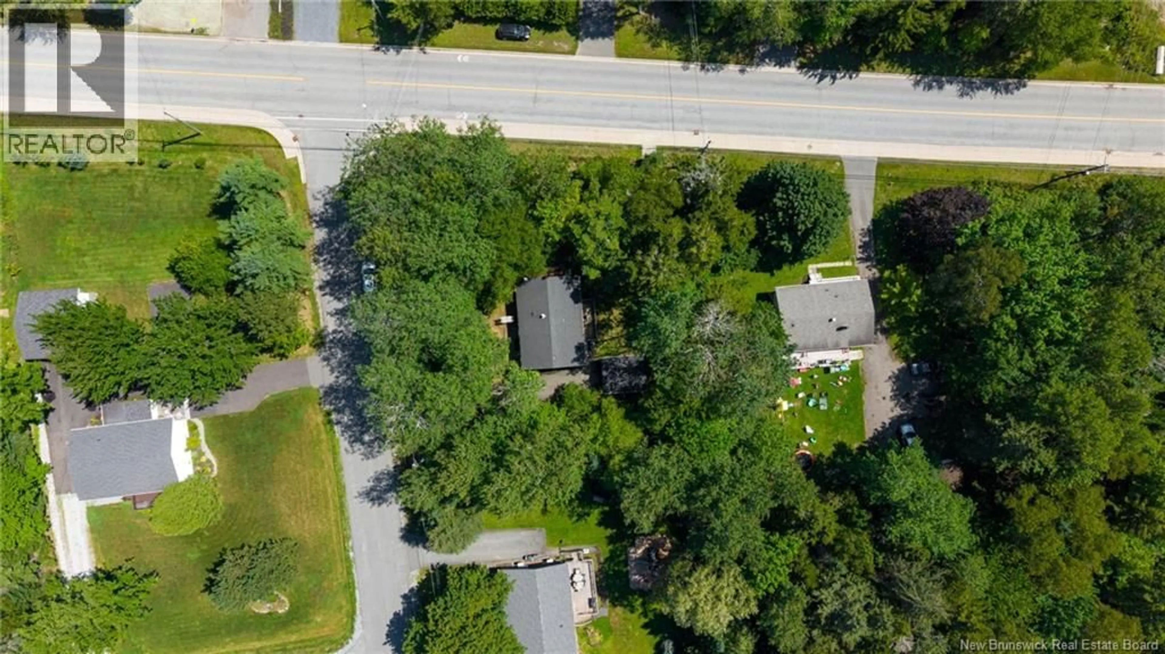 A pic from outside/outdoor area/front of a property/back of a property/a pic from drone, street for 1 PARKWOOD DRIVE, Quispamsis New Brunswick E2E1P4
