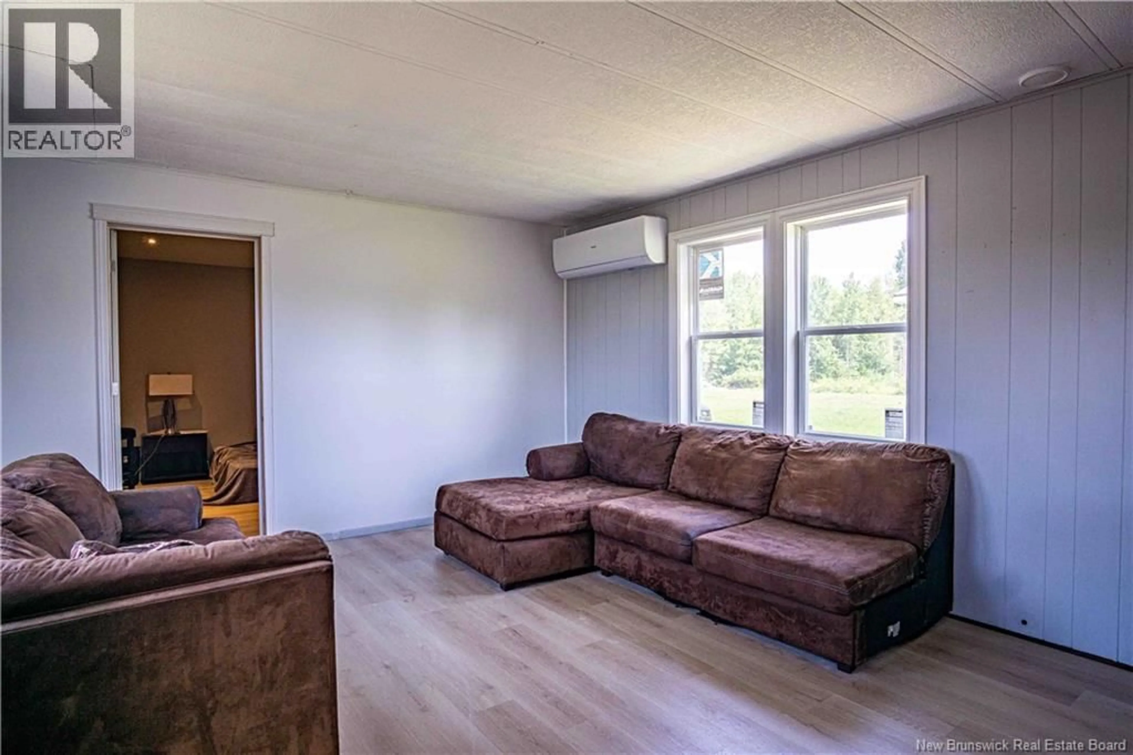Living room with furniture, wood/laminate floor for 423 ROUTE 105, Maugerville New Brunswick E3A8N3