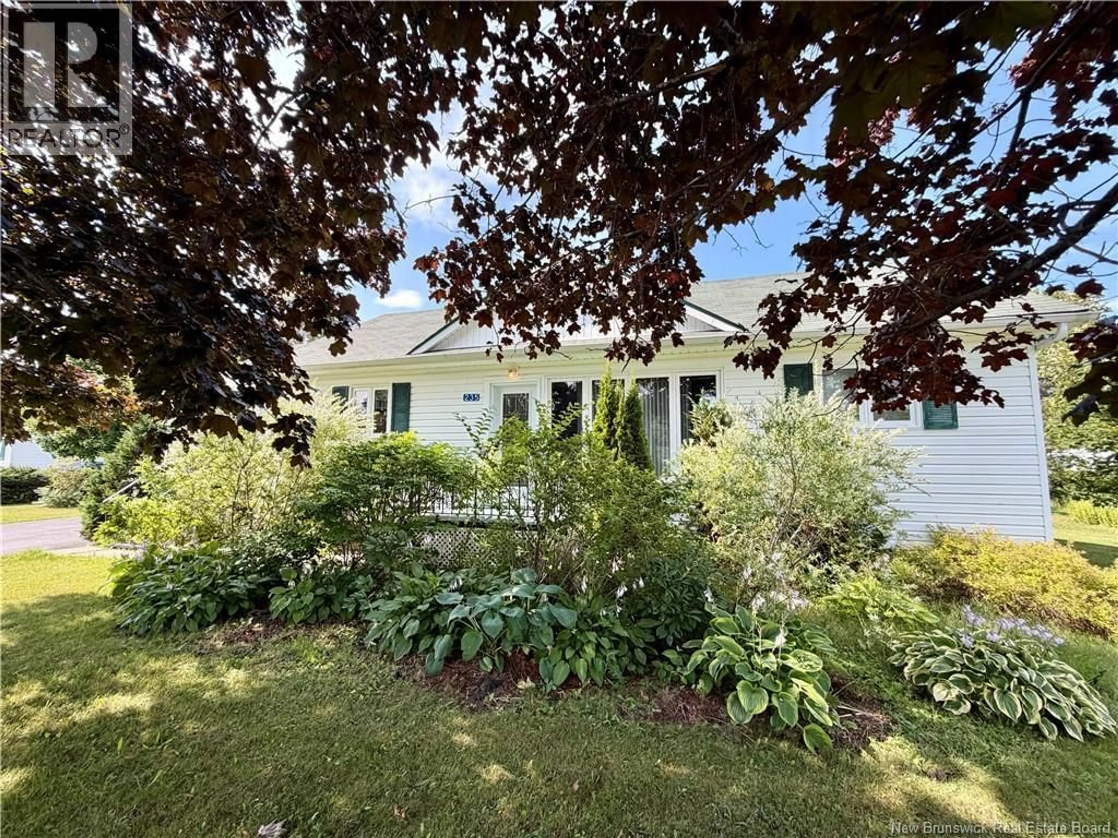A pic from outside/outdoor area/front of a property/back of a property/a pic from drone, street for 235 AVE DES PIONNIERS AVE, Balmoral New Brunswick E8E1B1