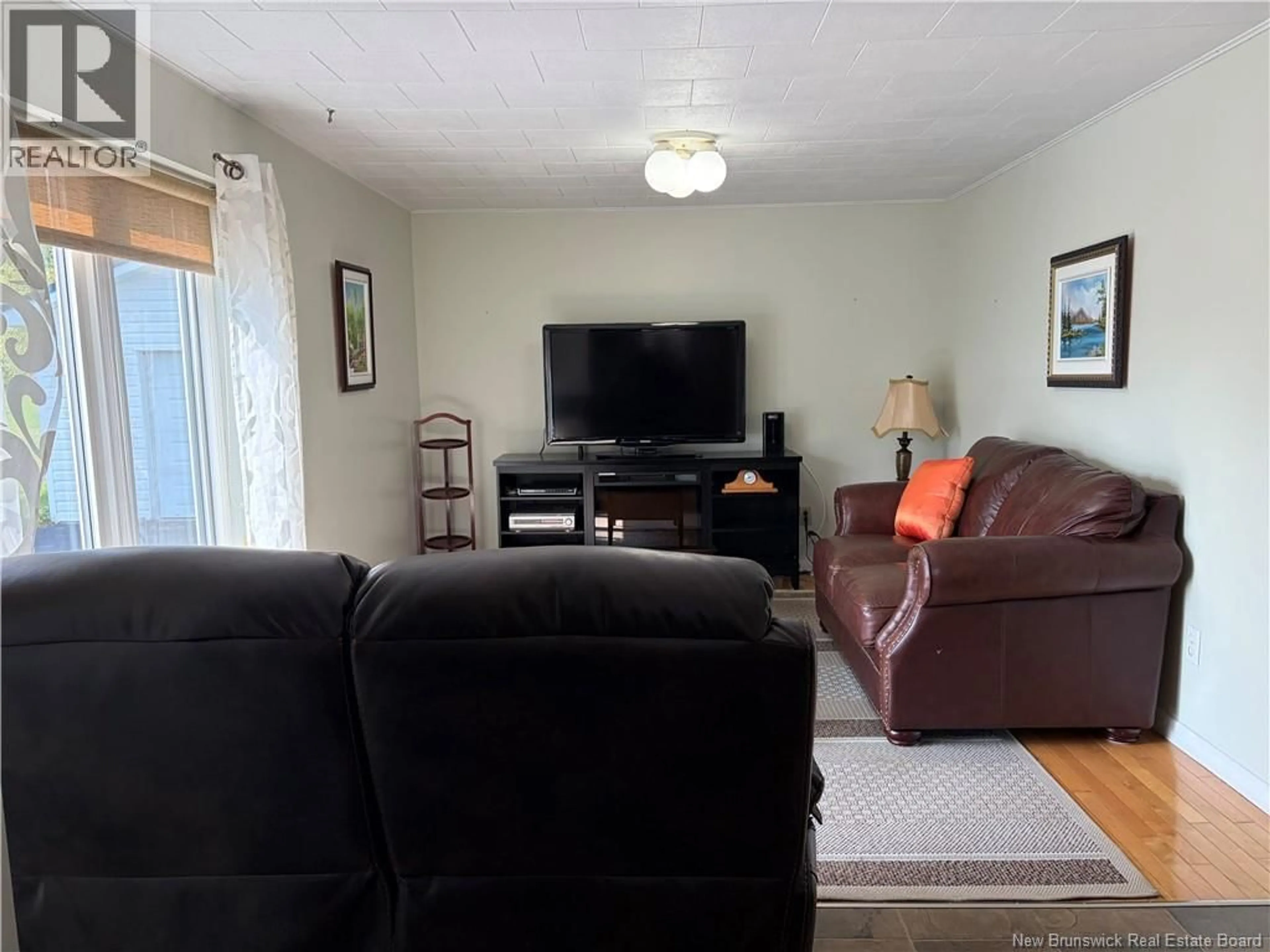 Living room with furniture, unknown for 235 AVE DES PIONNIERS AVE, Balmoral New Brunswick E8E1B1