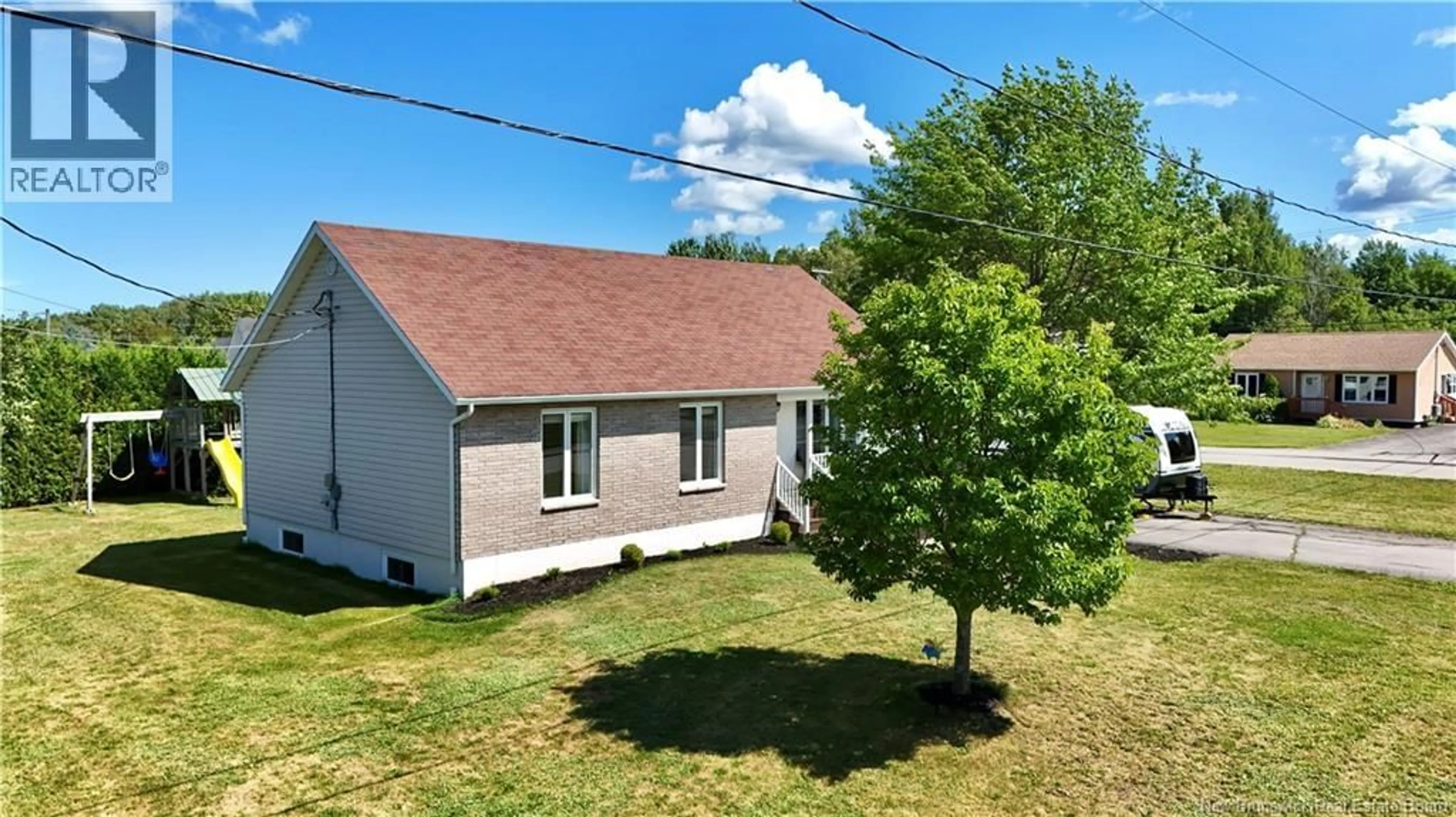 A pic from outside/outdoor area/front of a property/back of a property/a pic from drone, street for 1031 HACHE, Beresford New Brunswick E8K1H9