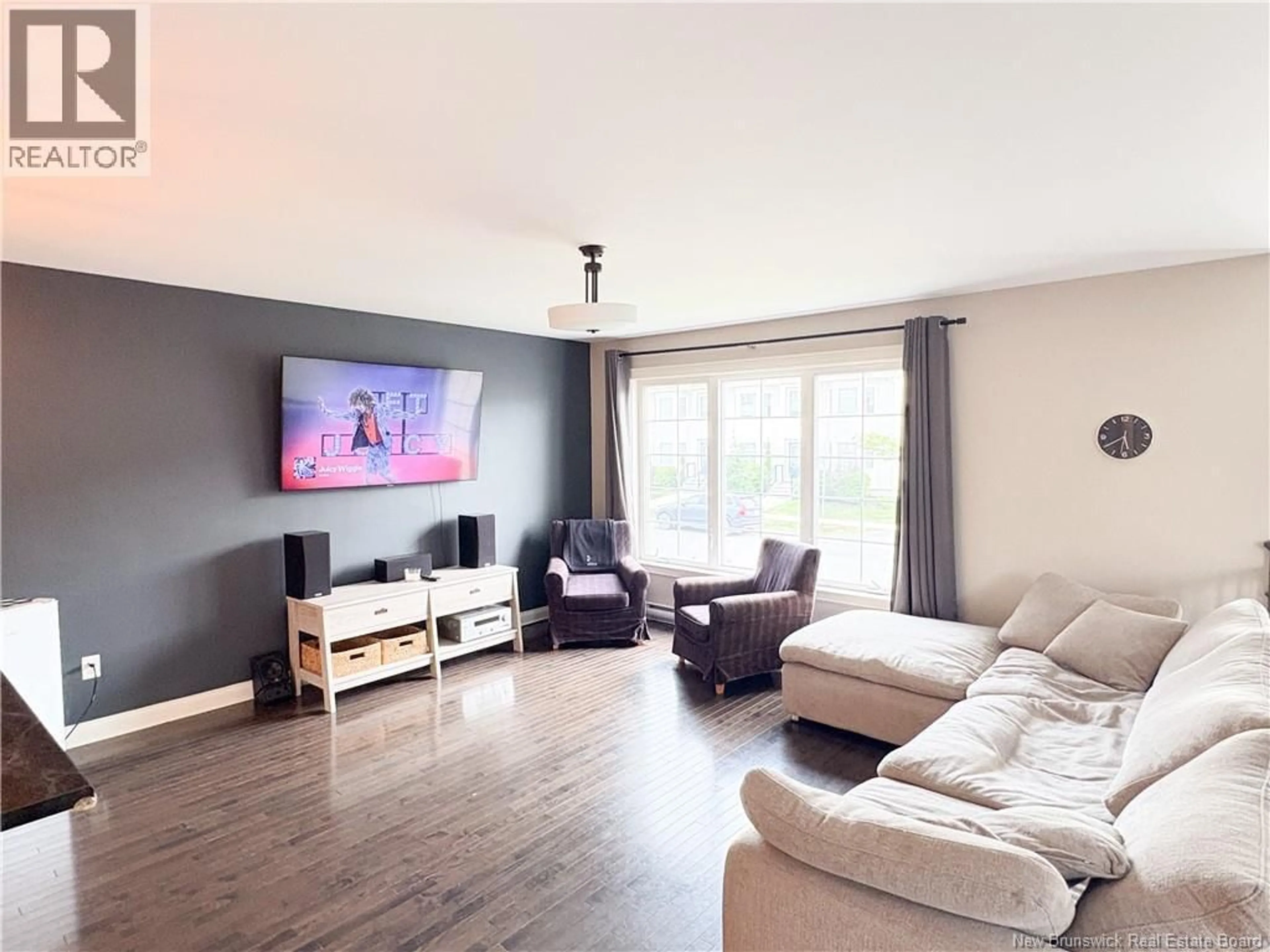 Living room with furniture, wood/laminate floor for 50 ASHLEY CRESCENT, Fredericton New Brunswick E3A9J2