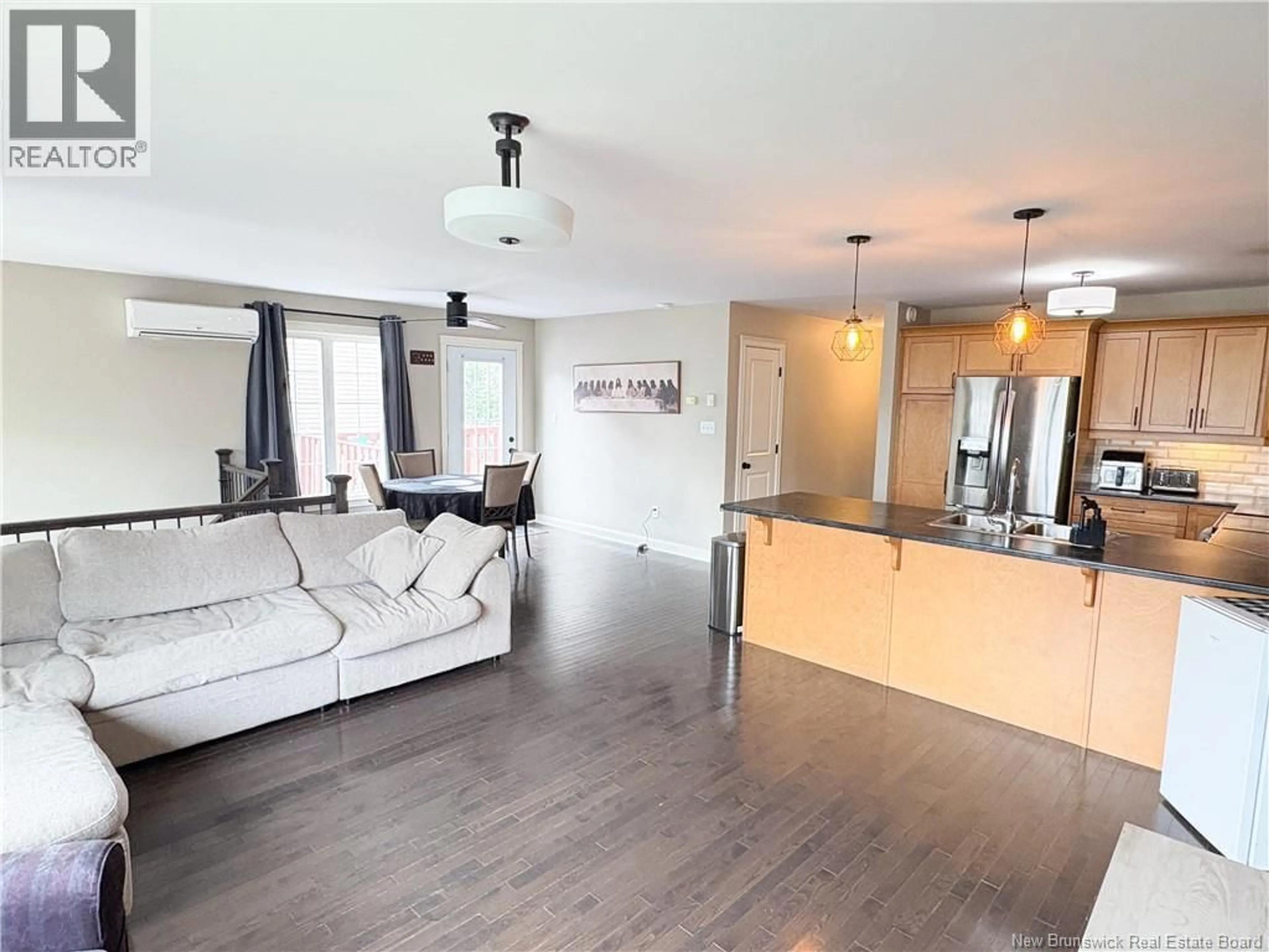 Open concept kitchen, wood/laminate floor for 50 ASHLEY CRESCENT, Fredericton New Brunswick E3A9J2